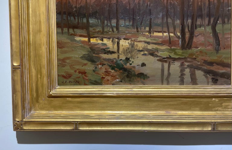 Very fine American painting by James Elwood Bundy, Indiana painter whole lived 1853-1933

Painting Depicts a beautiful Autumn Tonalist landscape with the reflections of the sunset and trees in the creek

Housed in a fabulous necomb macklin gilded
