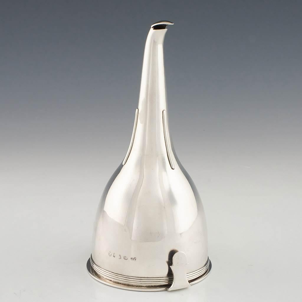 Heading : George III sterling silver wine funnel
Date : Hallmarked in London in 1804 for John Emes
Period : George III
Origin : London. England
Decoration : Fluted body. curved lip.
Size :  Height 15.1cm. base diameter 7.5cm
Condition : Excellent.