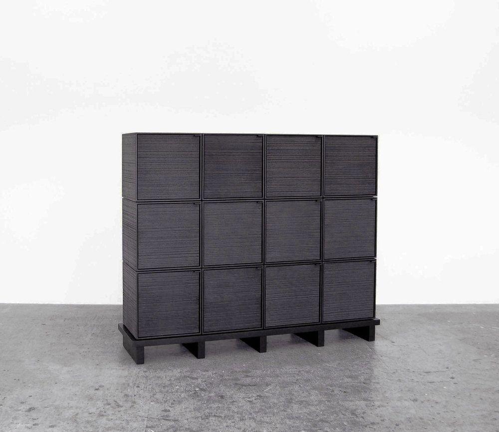 This monolithic cabinet from John Eric Byers merges bold, modern geometries with traditional craft. The wood is hand-sawn and lacquered with a distinctive textured pattern to give a sophisticated finish to a simplified silhouette.

John Eric Byers