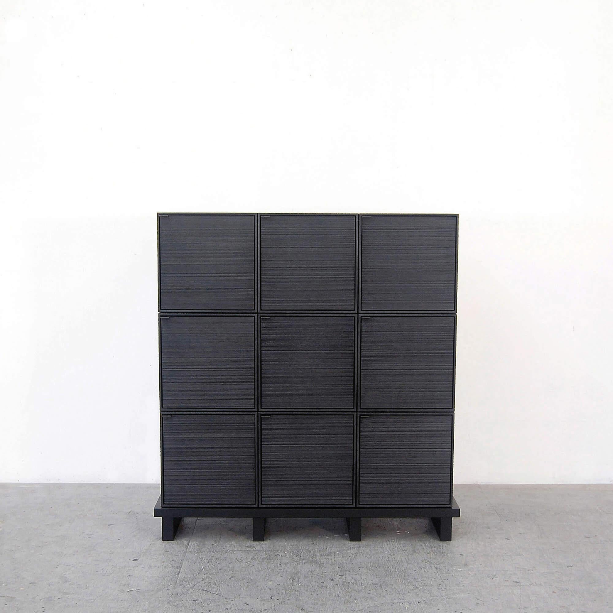 This monolithic cabinet from John Eric Byers merges bold, modern geometries with traditional craft. The wood is hand-sawn and lacquered with a distinctive textured pattern to give a sophisticated finish to a simplified silhouette.

John Eric Byers