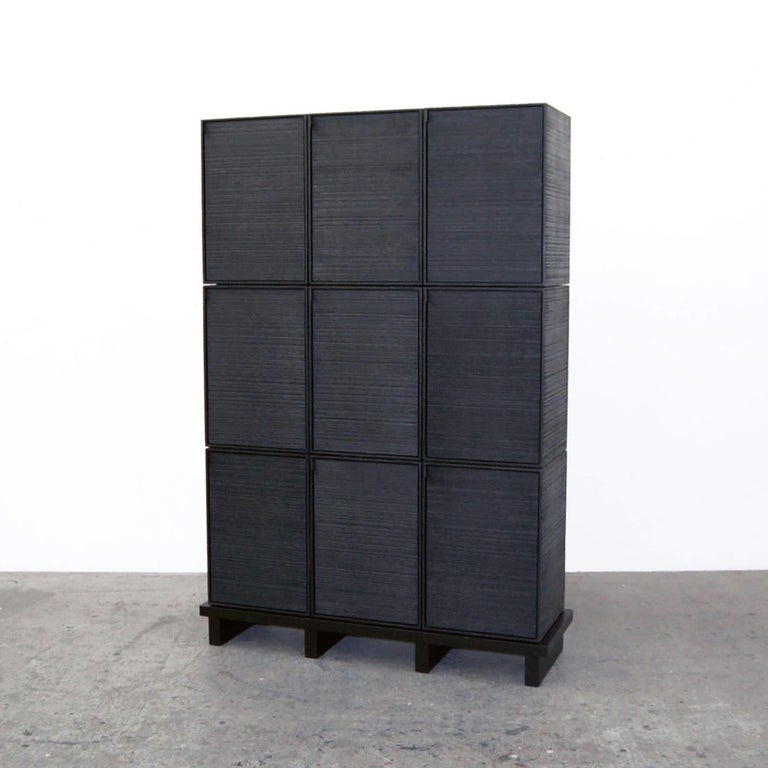This monolithic cabinet from John Eric Byers merges bold, modern geometries with traditional craft. The wood is hand-sawn and lacquered with a distinctive textured pattern to give a sophisticated finish to a simplified silhouette.

John Eric Byers