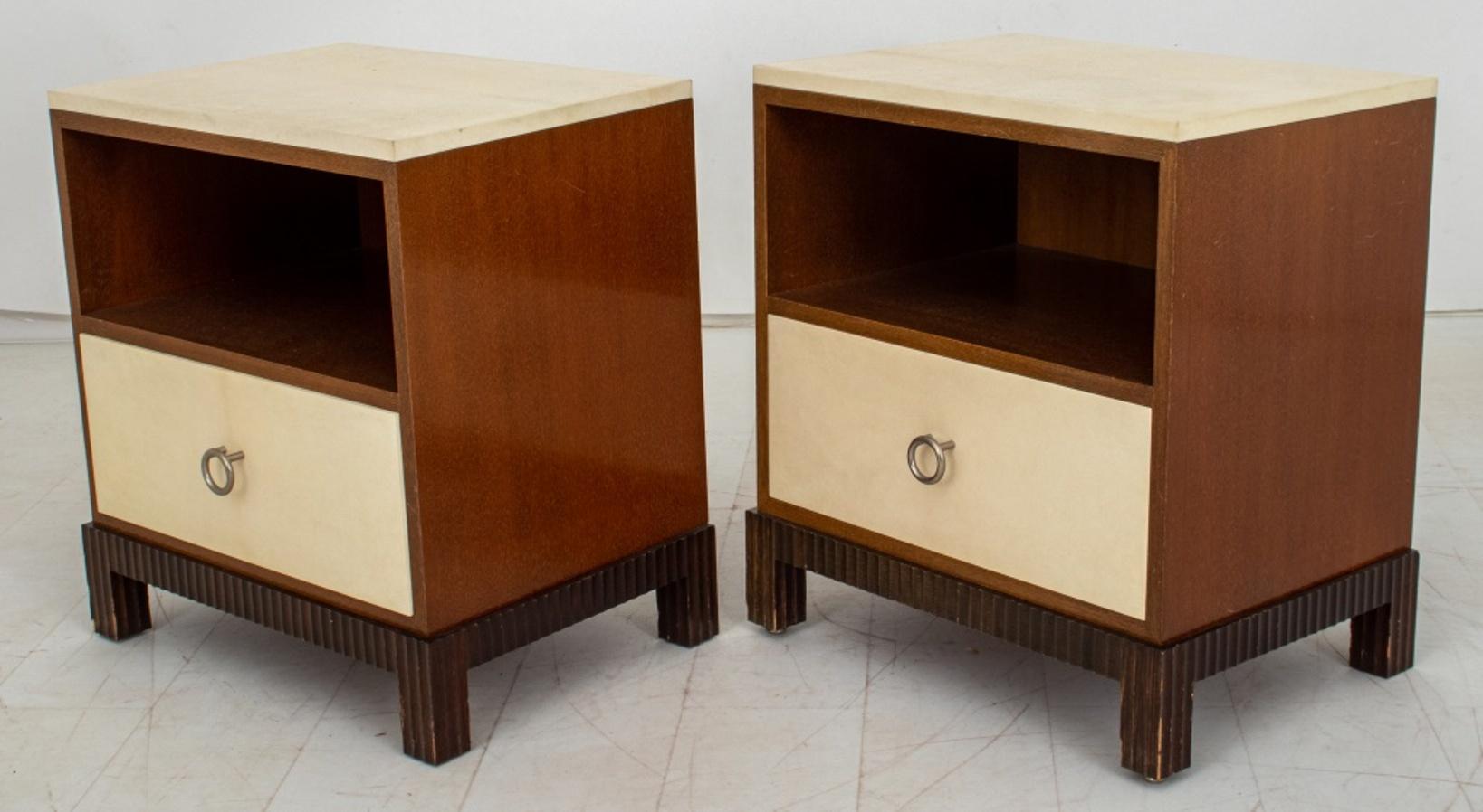 Pair of John Fischer Furniture parchment end tables, each with rectangular parchment surface above a mahogany recess over a short drawer with ring pull above incurved plinth on conforming feet. 
Provenance: Property From a Thad Hayes Designed
