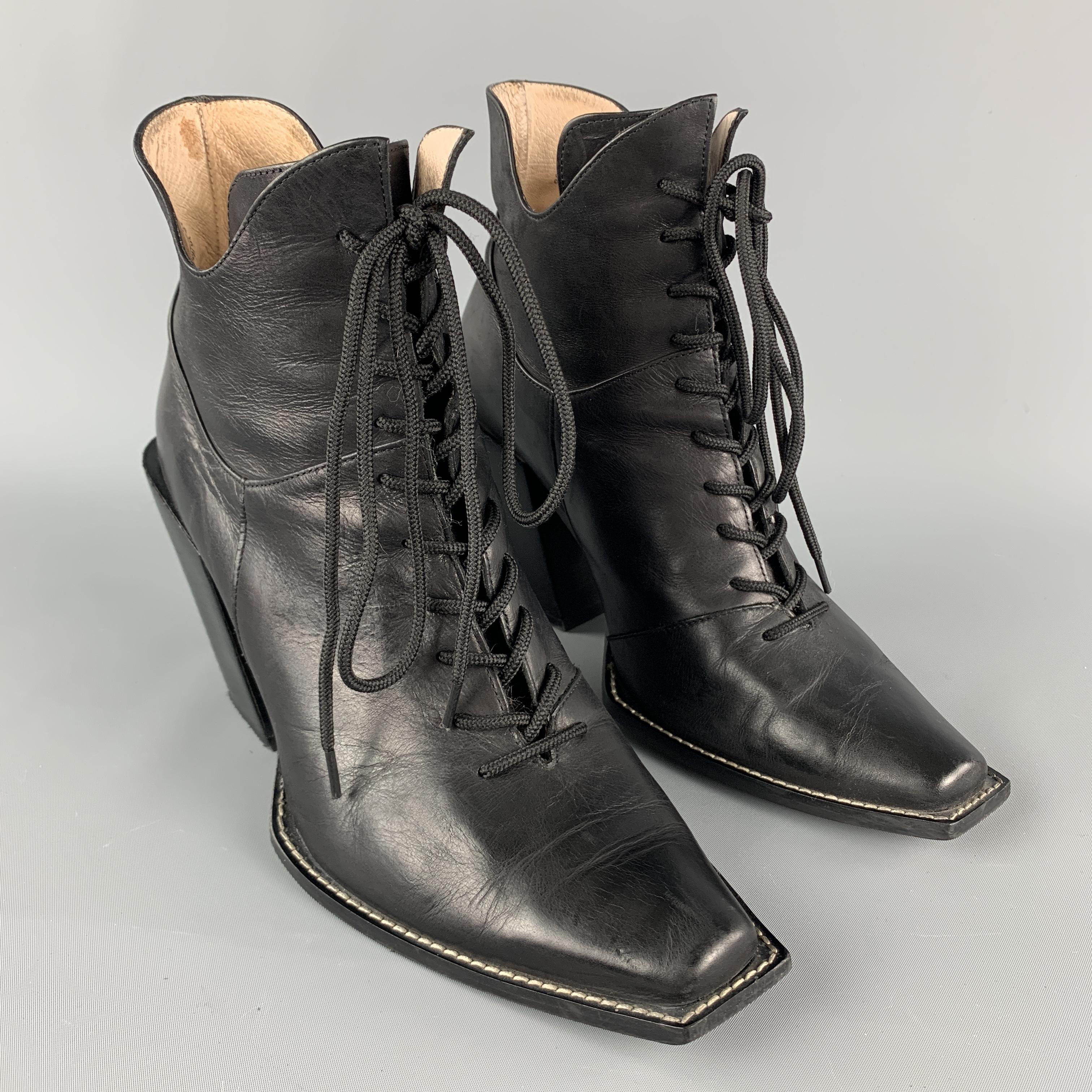 JOHN FLUEVOG Prince George Ankle Boots comes in a solid black leather material, featuring a contrast stitch, leather soles, leather wrapped slanted heels, lace up. Made in Portugal. 

Excellent Pre-Owned Condition.
Marked: 10

Measurements:

Heel: 4