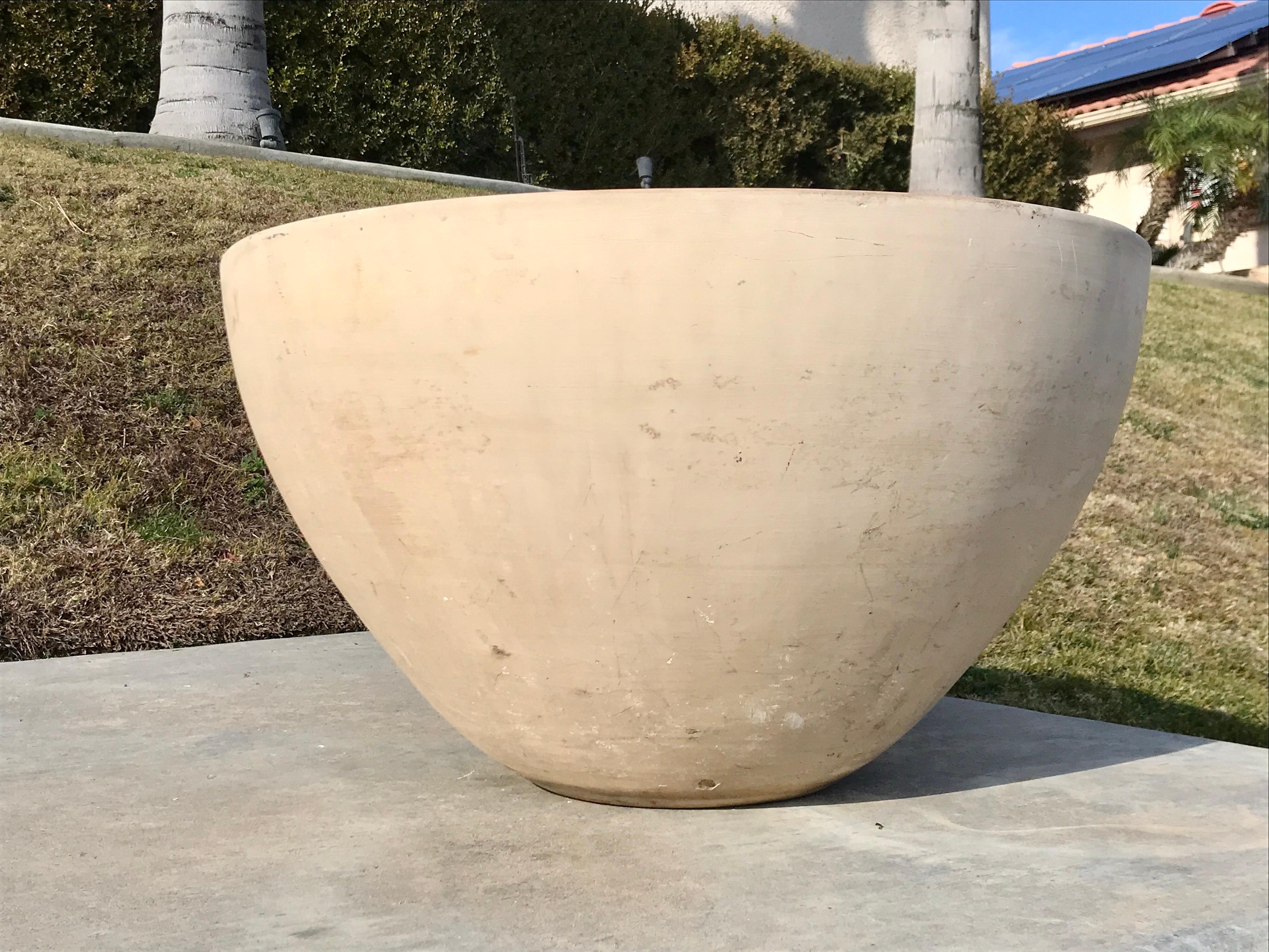 California design
Manufactured by Architectural Pottery USA
Natural bisque clay with a nice scale for a big cactus or succulent or use as a catch-all for blankets and firewood 
Like an old Etruscan vase it shows wear with a nice patina, minor