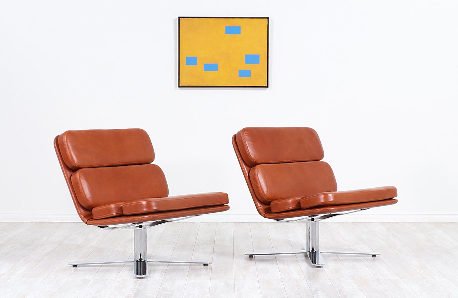 A pair of California modernist chairs designed by John Follis in collaboration with American company Fortress in the 1970s. Known as the 