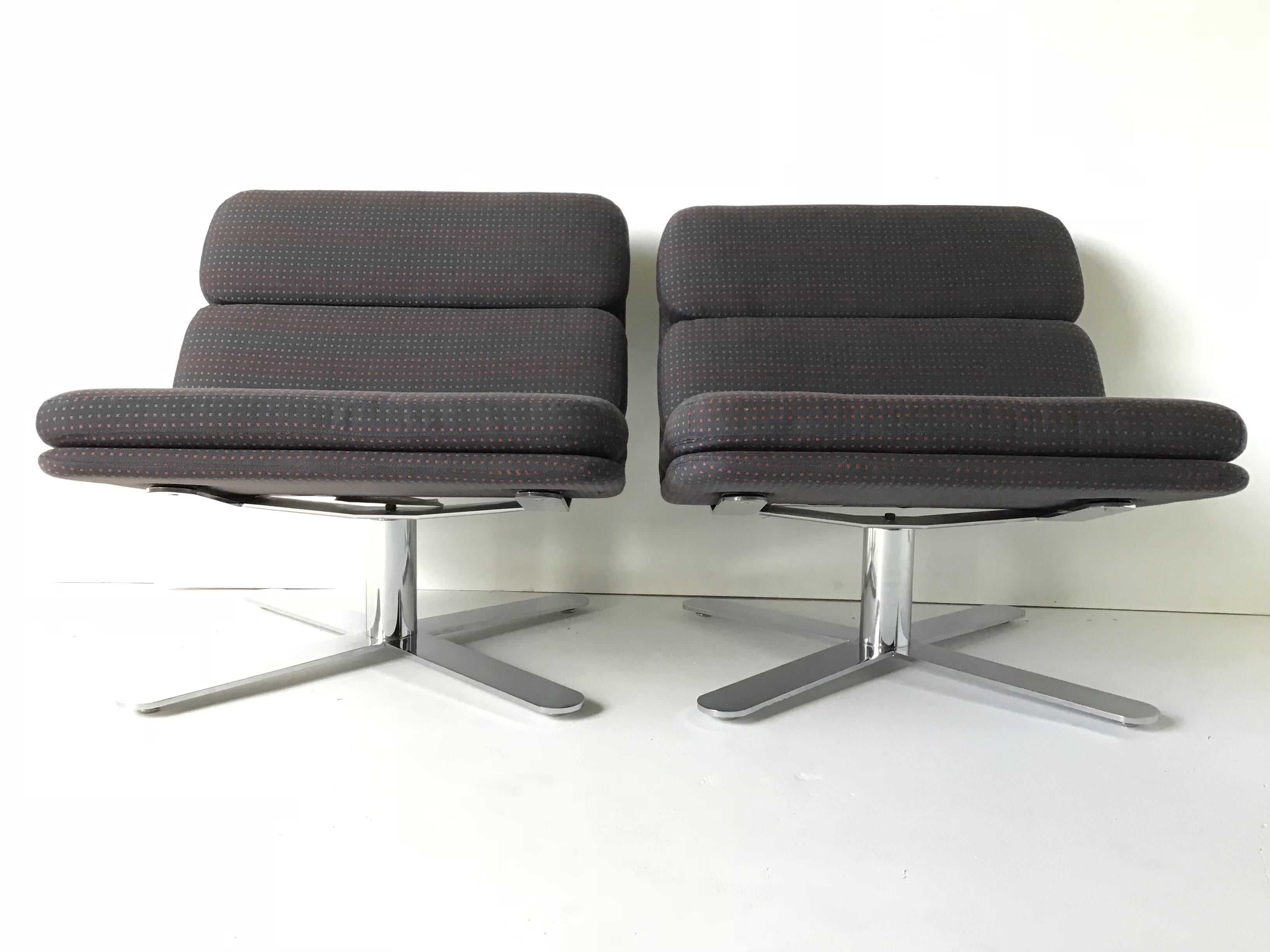 This pair of chairs is super sleek! I love the heavy duty flat bar heavy chrome bases and brackets that curve up the backs! These are “Solo” lounge chairs designed by John Follis in the 1980s for Fortress. They are in their original 1985 techno