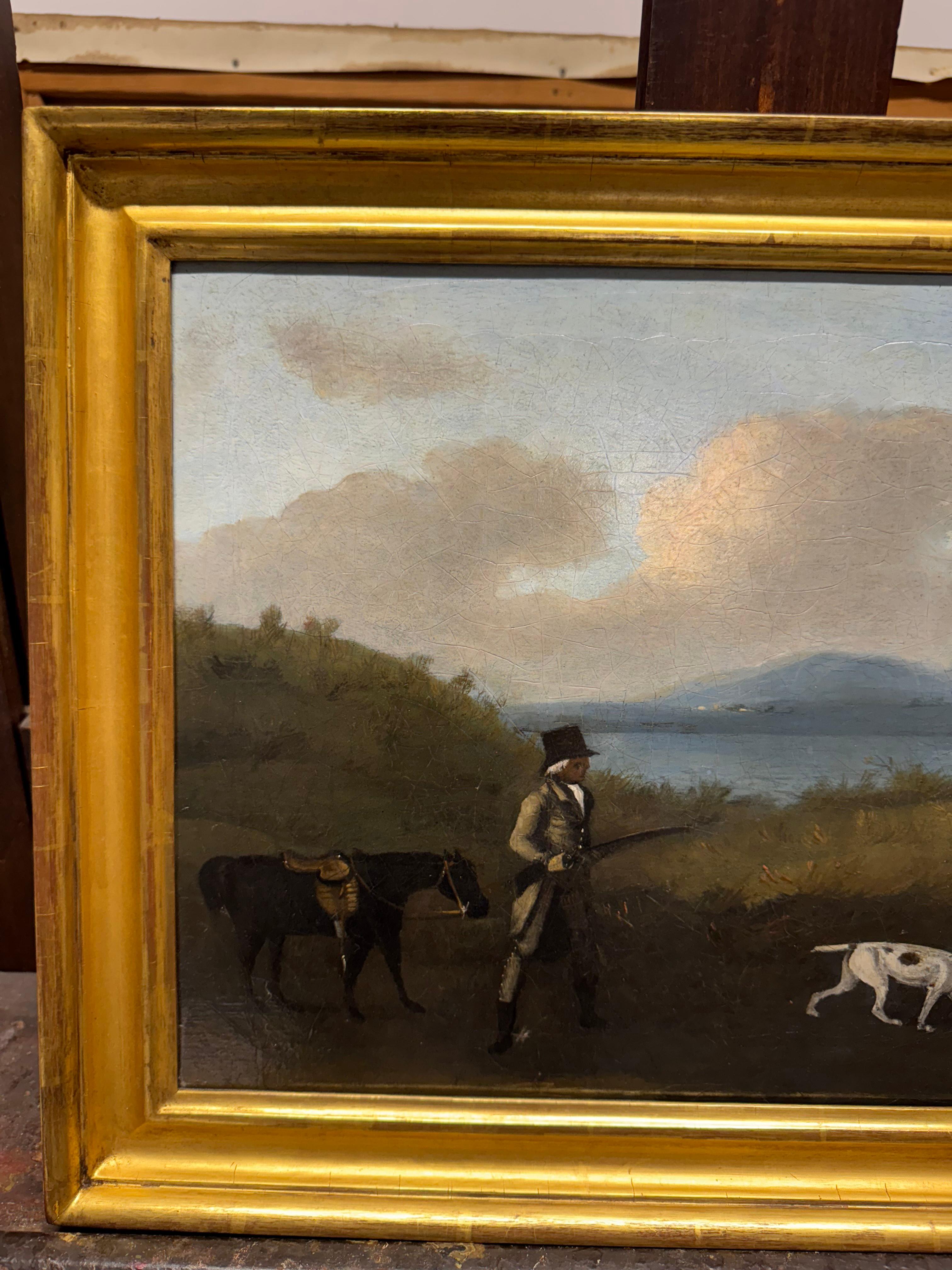 A Gentleman shooting in a landscape with a horse and spaniels 2