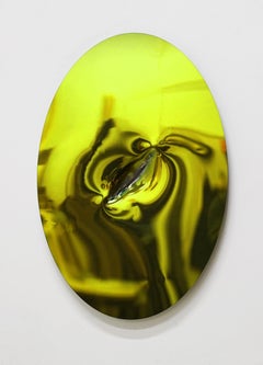 Shiny oval steel artwork with yellow green mirrored surface 63 x 42 cm