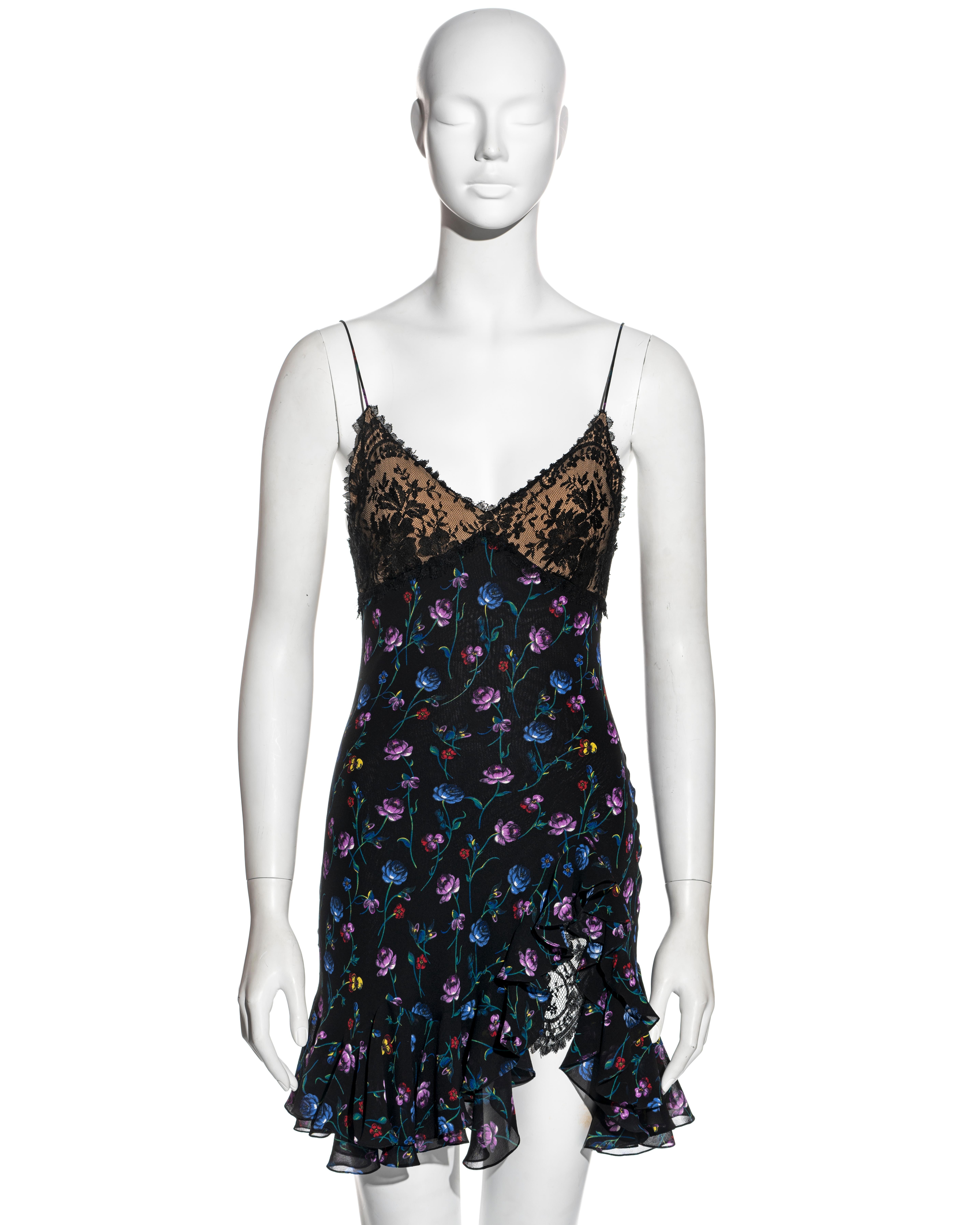 ▪ Rare John Galliano ivory silk jacquard mini slip dress 
▪ Blue, purple, yellow and red floral print with black base  
▪ Breast cups with Chantilly lace overlay  
▪ Spaghetti straps  
▪ Bias-cut  
▪ Flounce mini skirt with two layers  
▪ High leg