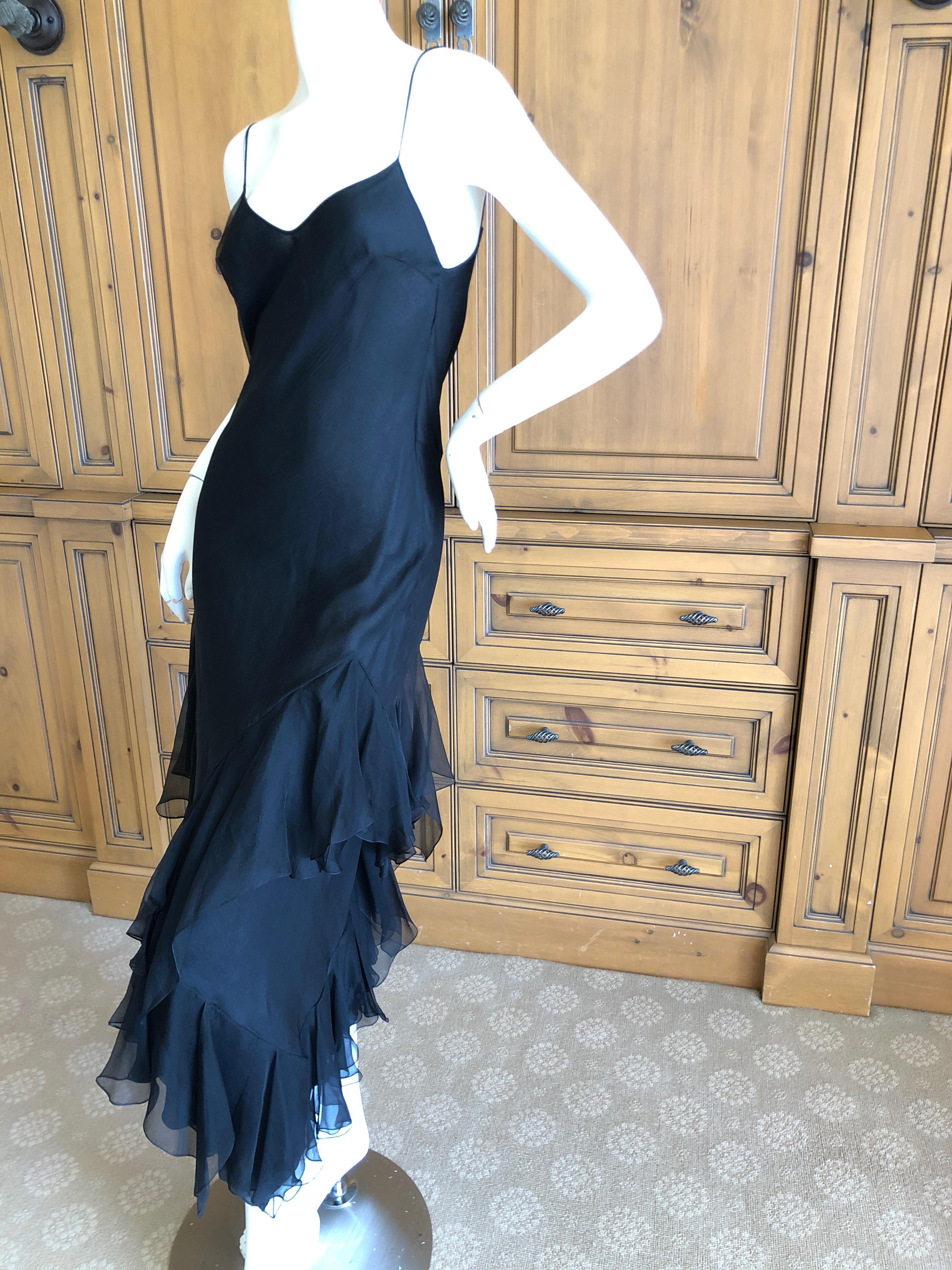 John Galliano 1990's Bias Cut Black Slip Dress with Flamenco Ruffles.
So pretty, simple and elegant .
Size 40
Bust 36