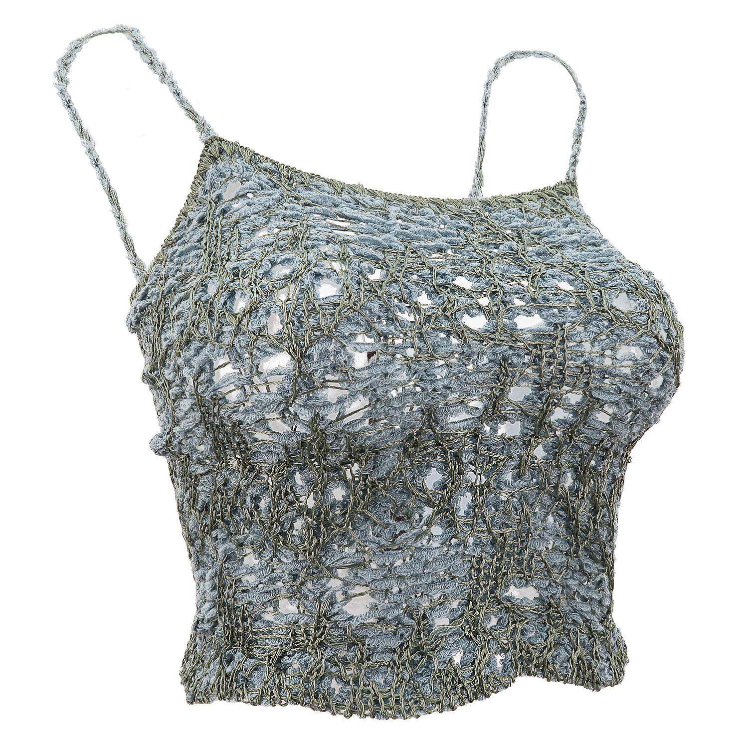 Sensuality and craftsmanship are two elements you’ll keep finding in John Galliano’s work, whether it be for himself or the houses he designed for. This crochet effect strappy top is an early example of how he managed to reconcile ancient techniques