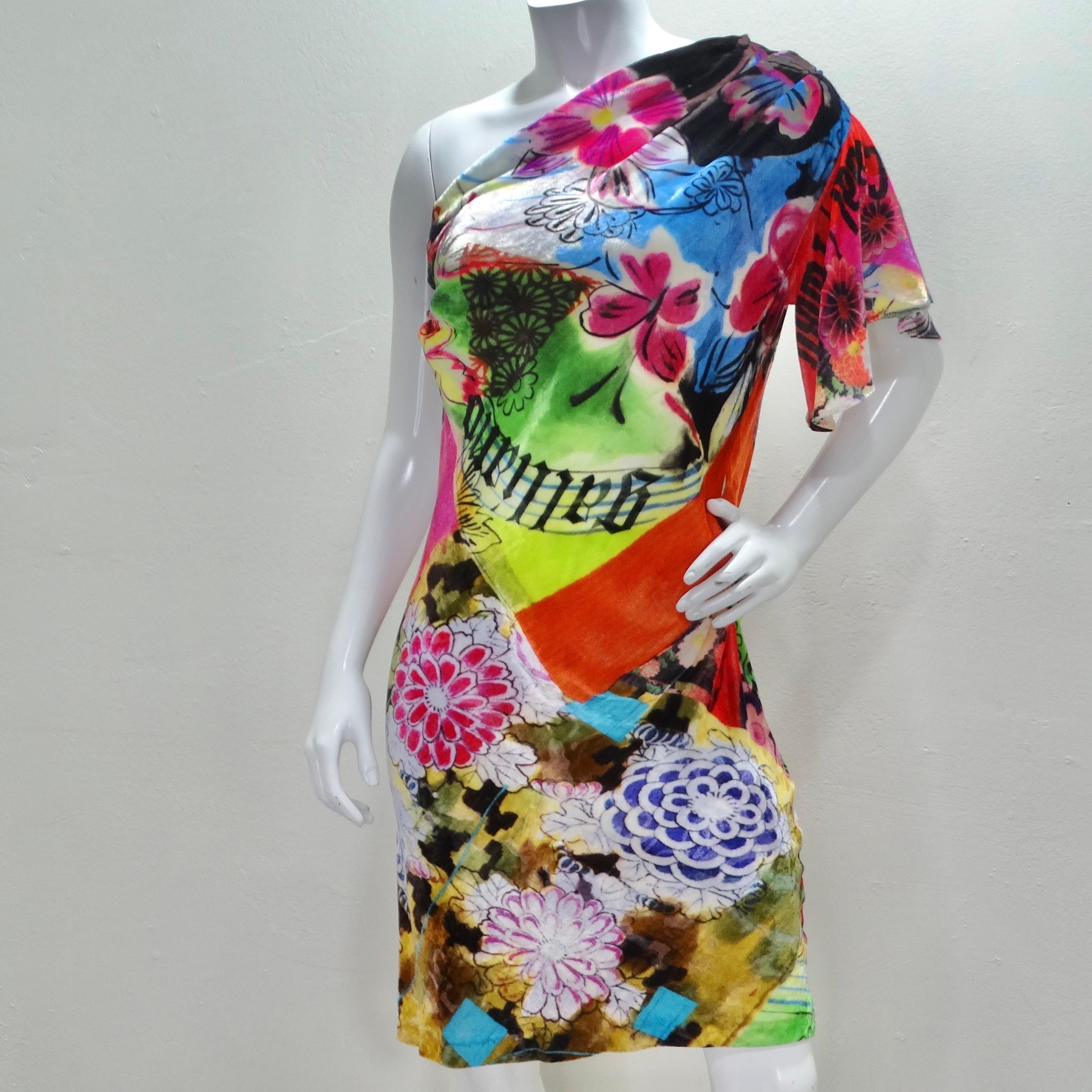 Step into a world of retro elegance with this 1990s John Galliano Floral Asymmetric Dress. Crafted from sumptuously soft velvet in a vibrant multicolor palette, this dress is a true work of art. It's adorned with intricate flowers, prints, and even