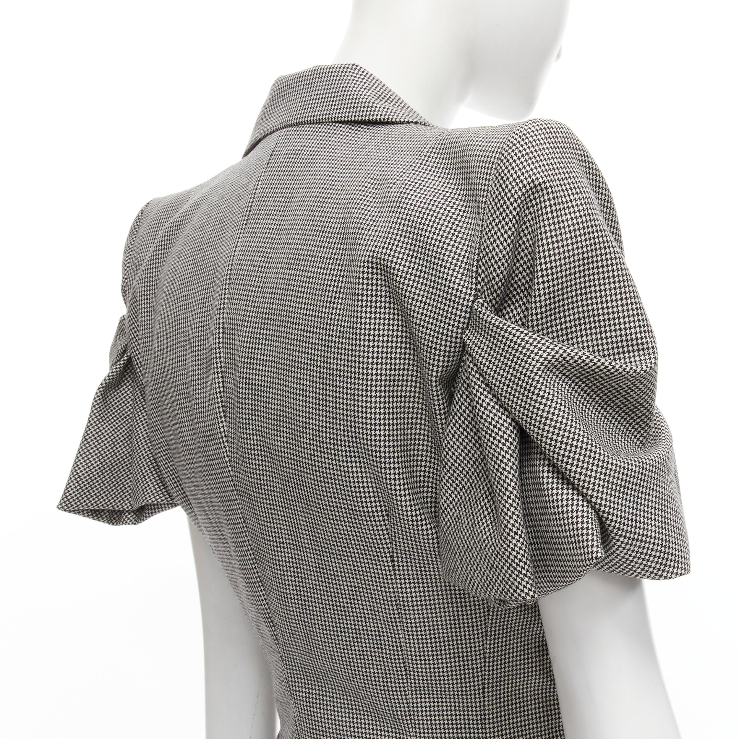JOHN GALLIANO 1995 Vintage grey houndstooth padded hip jacket skirt Madonna IT40 
Reference: CRTI/A00599 
Brand: John Galliano 
Designer: John Galliano 
Collection: Spring Summer 1995 Runway As seen on: Madonna 
Material: Wool 
Color: Grey 
Pattern: