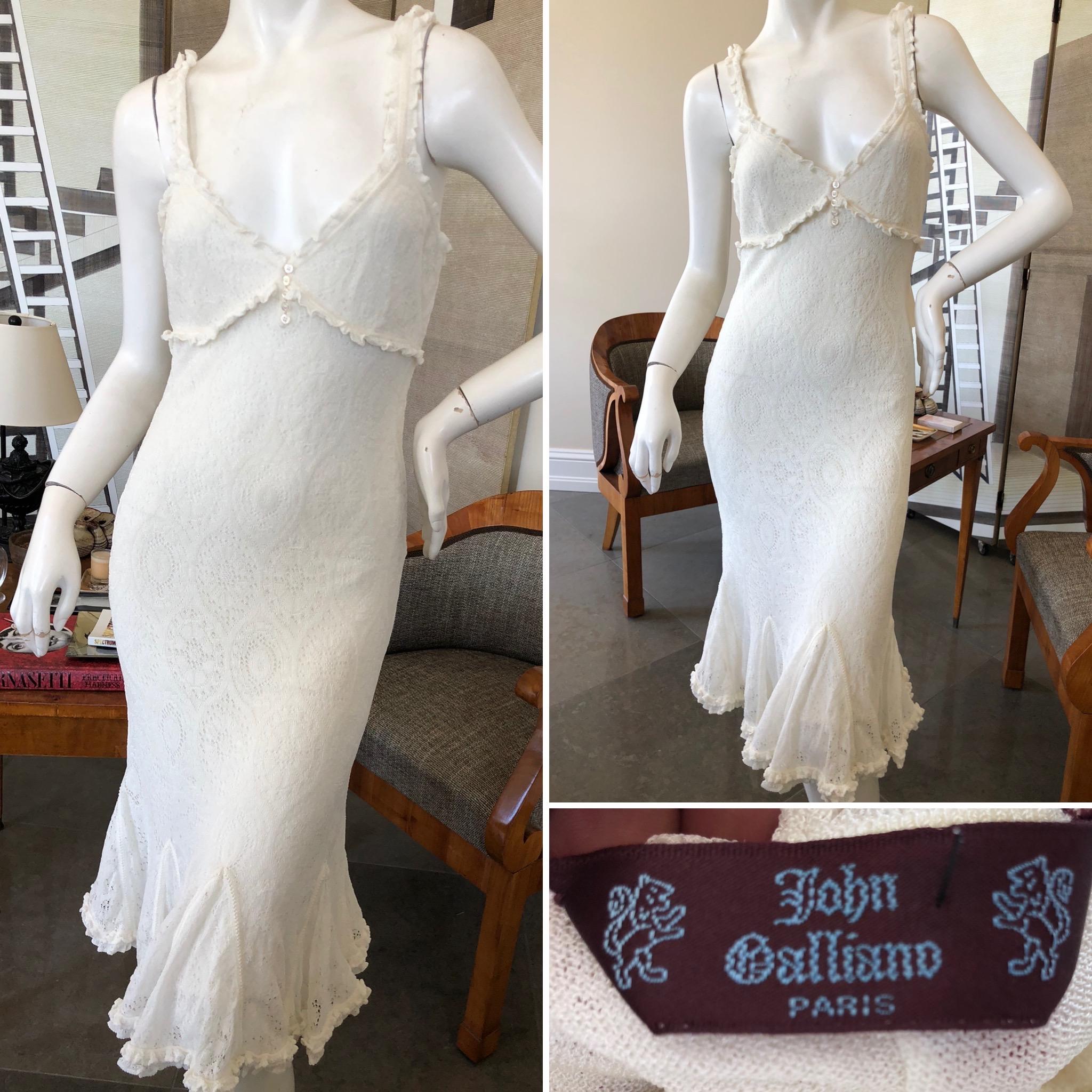 John Galliano 1999 Ivory Pattern Knit Dress with Ruffled Flounce Hem.
This is so pretty, but difficult to photograph.
There is no size tag Appx size 36-38
 Bust 36