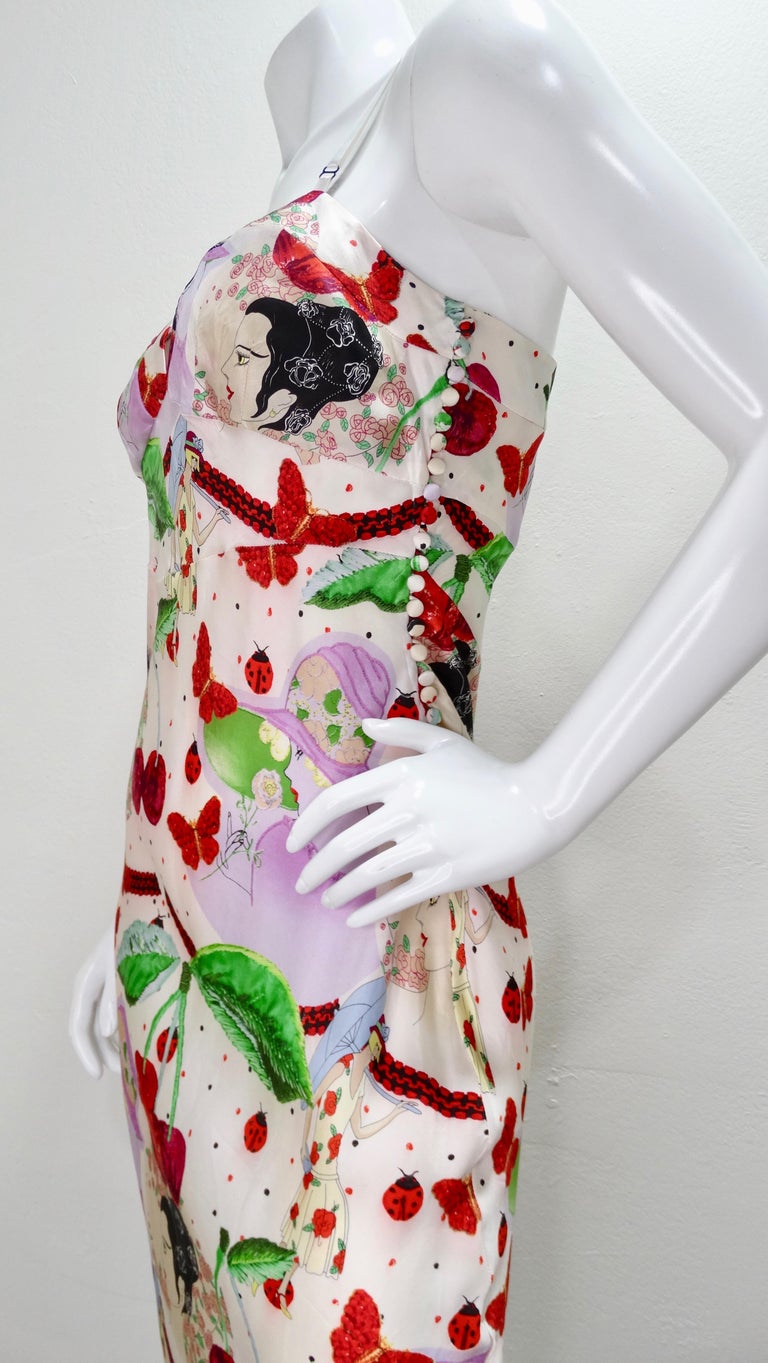 Add some print to your wardrobe with this adorable Galliano dress! Circa 2000s, this silk slip dress is covered in an eclectic motif that features cherries, ladybugs, polka dots, butterflies and portraits of vintage fashion models. Includes