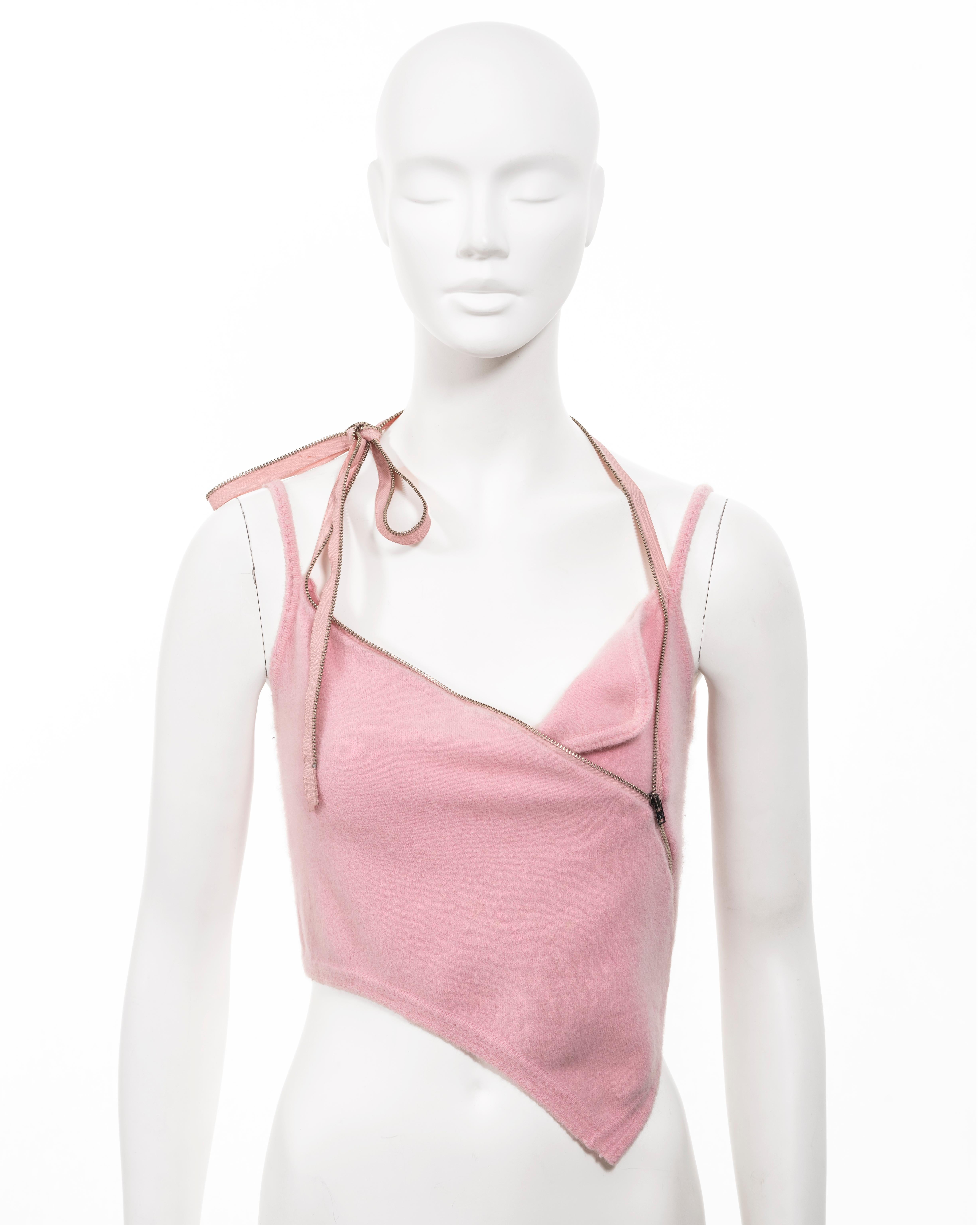 ▪ John Galliano crop top
▪ Spring-Summer 2000
▪ Constructed from baby pink fuzzy Angora 
▪ Asymmetric cut 
▪ Zip fastening at the chest extending into two halter-neck ties 
▪ Spaghetti straps 
▪ Size 'M' 
▪ Made in Italy 
▪ 48% Angora, 38% Nylon, 9%