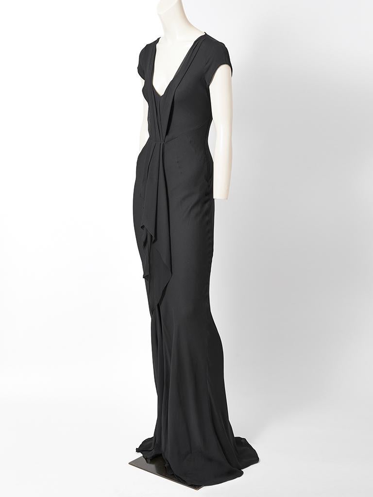 John Galliano, black, silk twill, bias cut evening gown, having cap sleeves, deep v neckline with an attached pleated silk chiffon scarf going down the center front. Dress has a long train in the back.