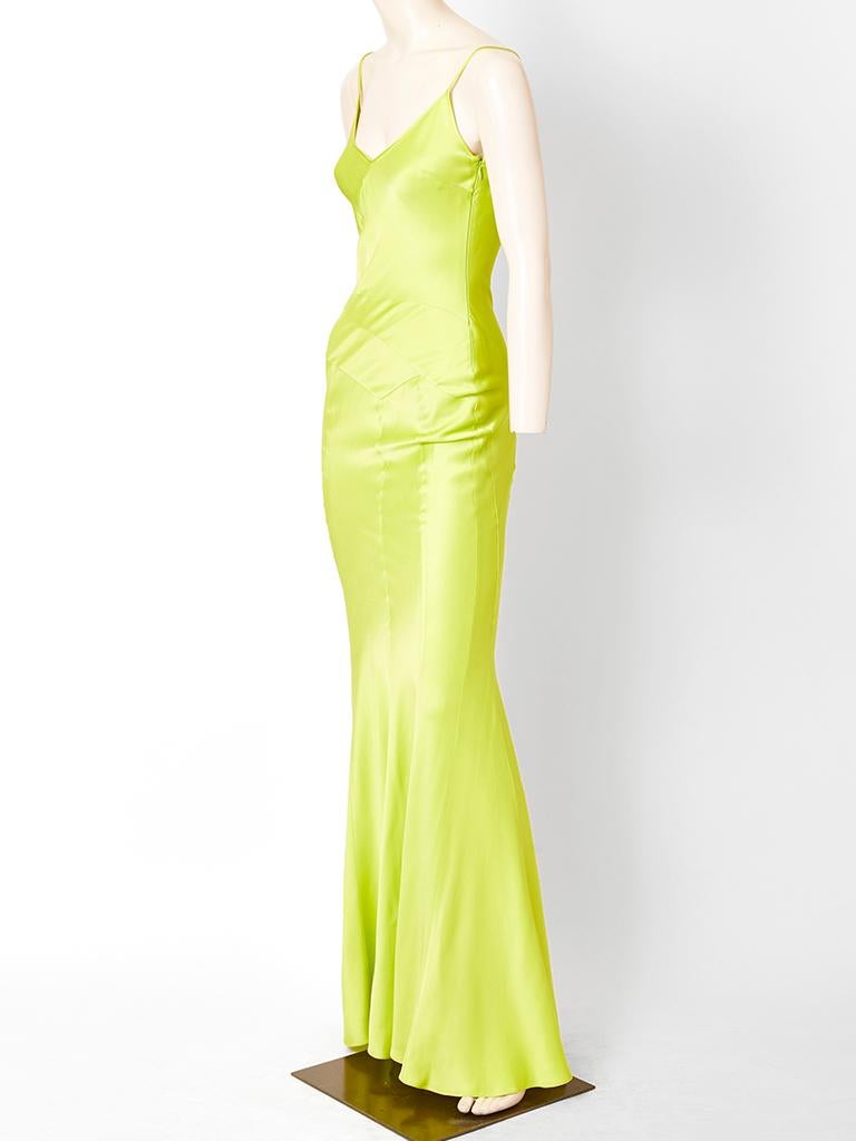John Galliano, simple, bias cut, chartreuse tone, slip, gown having a nude tone, tulle detail at the upper back.