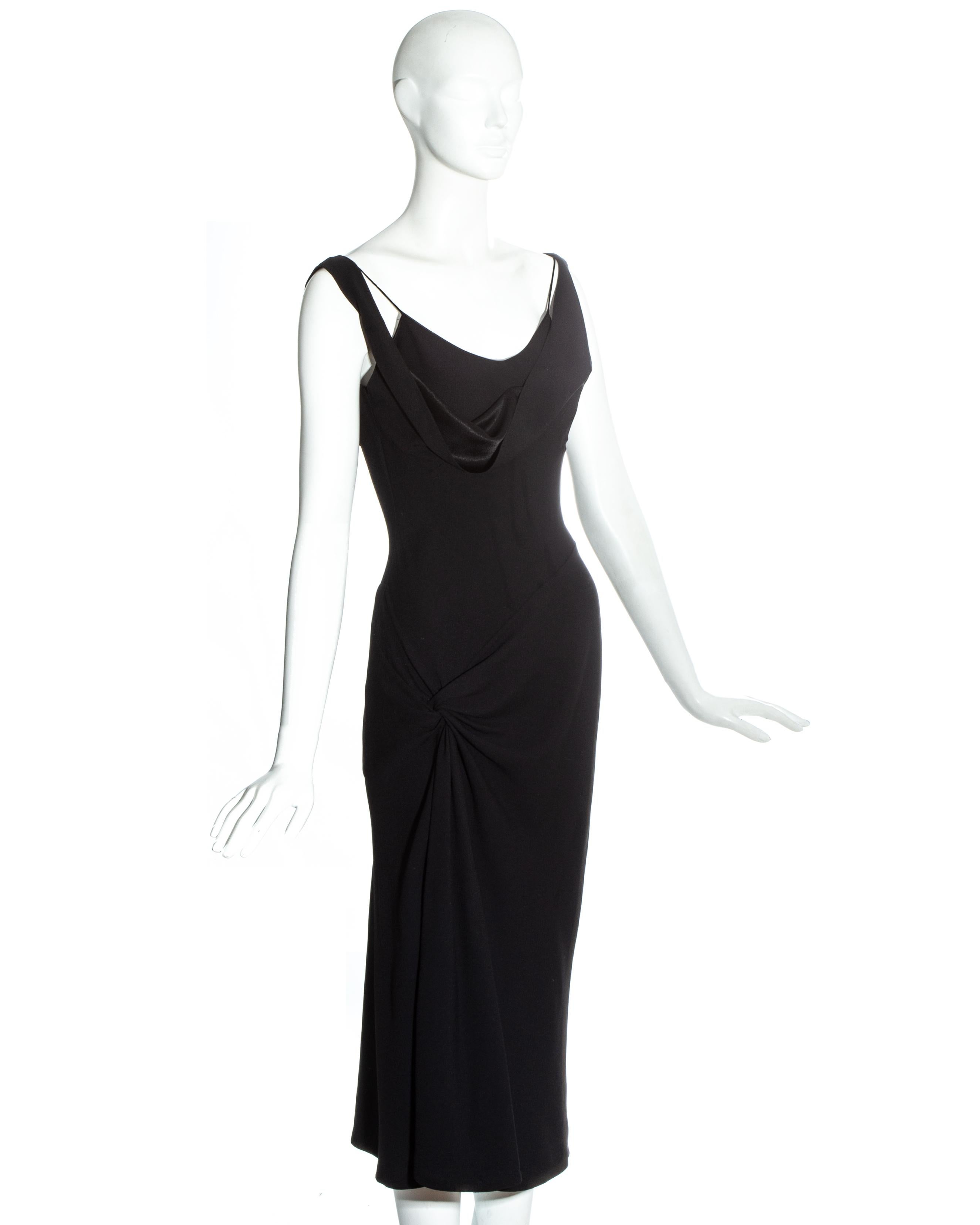 John Galliano black acetate mid-length evening dress with draped neckline with off-shoulder shoulder strap and twisted drape on right hip

Fall-Winter 1999