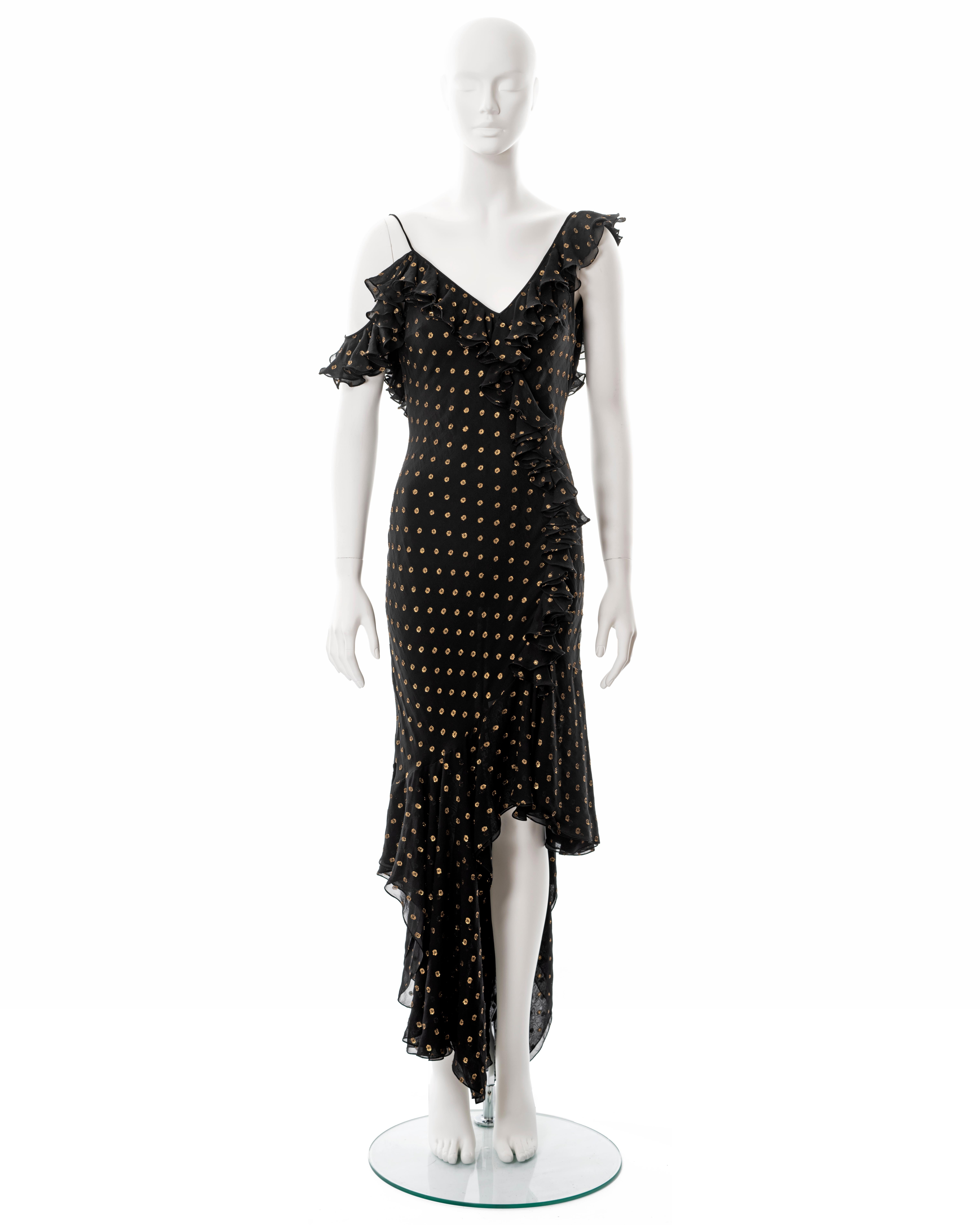▪ John Galliano evening dress
▪ Constructed from black bias-cut silk chiffon with metallic gold polkadots 
▪ Ruffled trim
▪ Low back
▪ Off-shoulder strap
▪ High-low skirt with asymmetric hemline 
▪ FR 42 - UK 14 - US 8
▪ Made in France

All