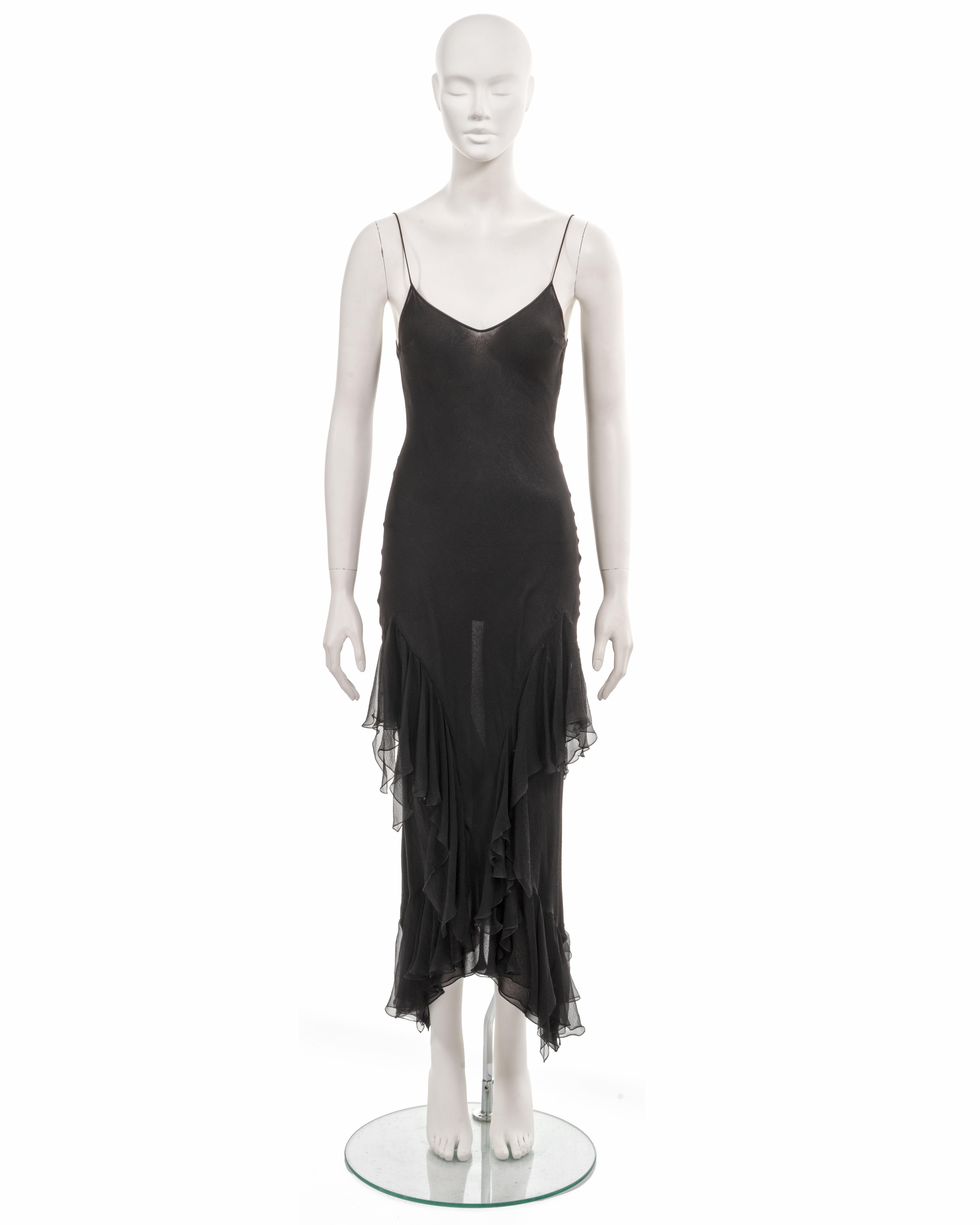 ▪ Archival John Galliano evening dress
▪ Sold by One of a Kind Archive
▪ Fall-Winter 1997
▪ Black bias-cut silk chiffon
▪ Double-layered 
▪ Spaghetti straps 
▪ Ankle length skirt with ruffled trims 
▪ FR40 - UK12 - US8
▪ Made in France  

All
