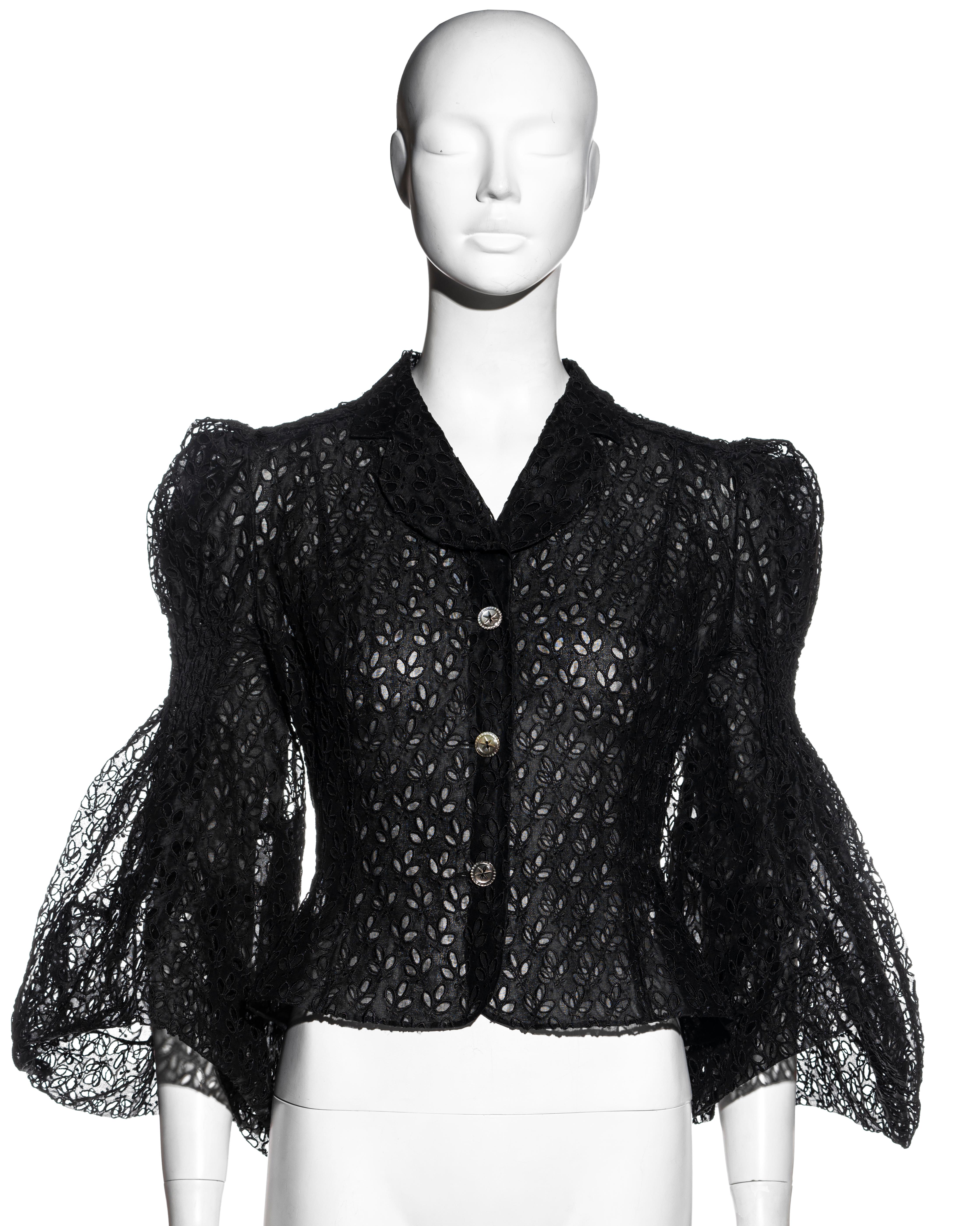 ▪ John Galliano black cutwork cotton organza blouse 
▪ Smocking to the upper sleeve 
▪ Puff shoulders 
▪ Wide bell sleeves 
▪ Organza lining 
▪ Overlay: 66% Cotton, 34% Rayon - Lining: 100% Cotton
▪ FR 40 - UK 12 - US 8
▪ Spring-Summer 1996