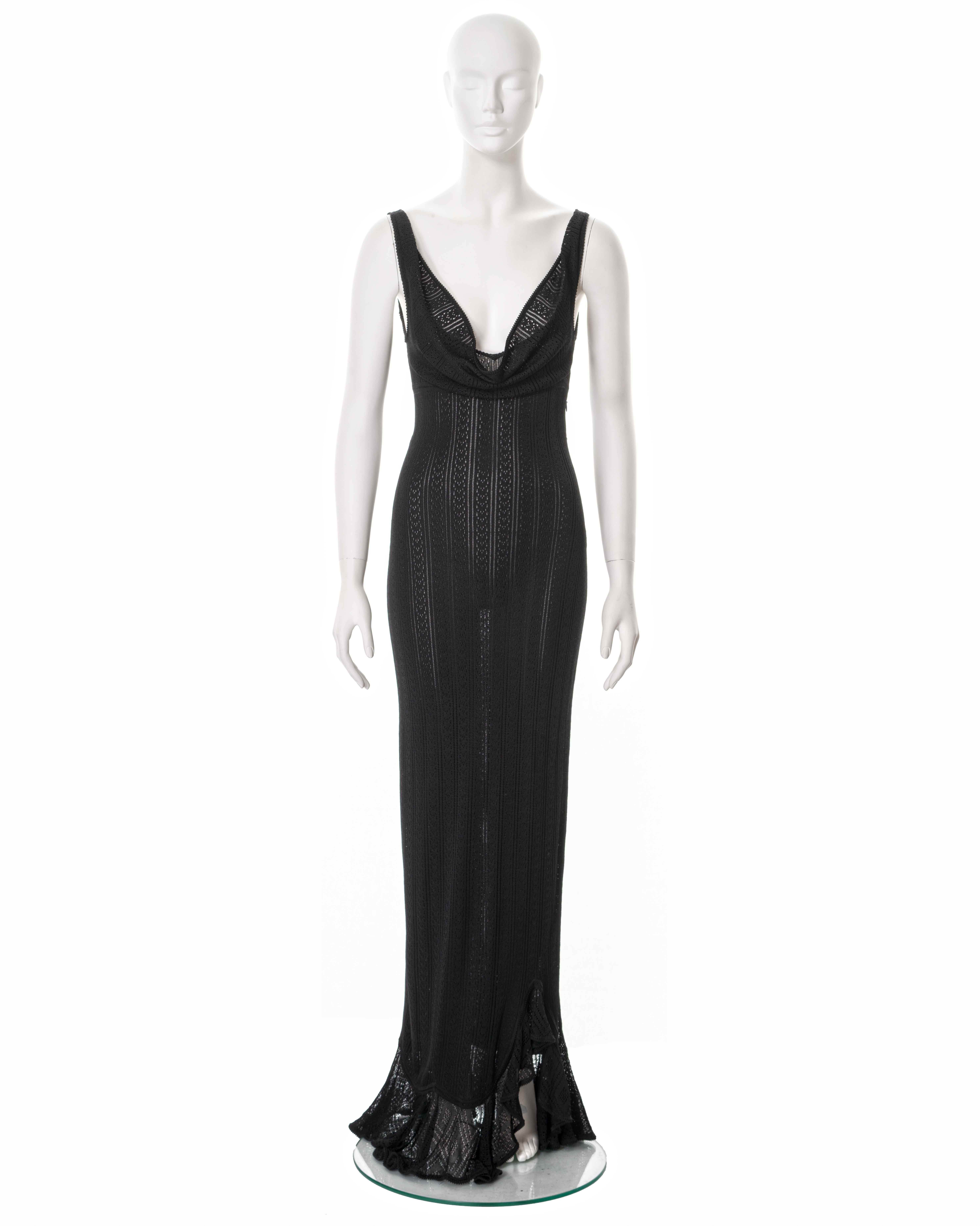 ▪ John Galliano evening dress
▪ Spring-Summer 1998
▪ Constructed from black viscose knitted lace 
▪ Cowls to the front and back 
▪ Plunging neckline 
▪ Open low back
▪ Floor length skirt with flounced hemline 
▪ Size Medium
▪ Made in Italy  

All