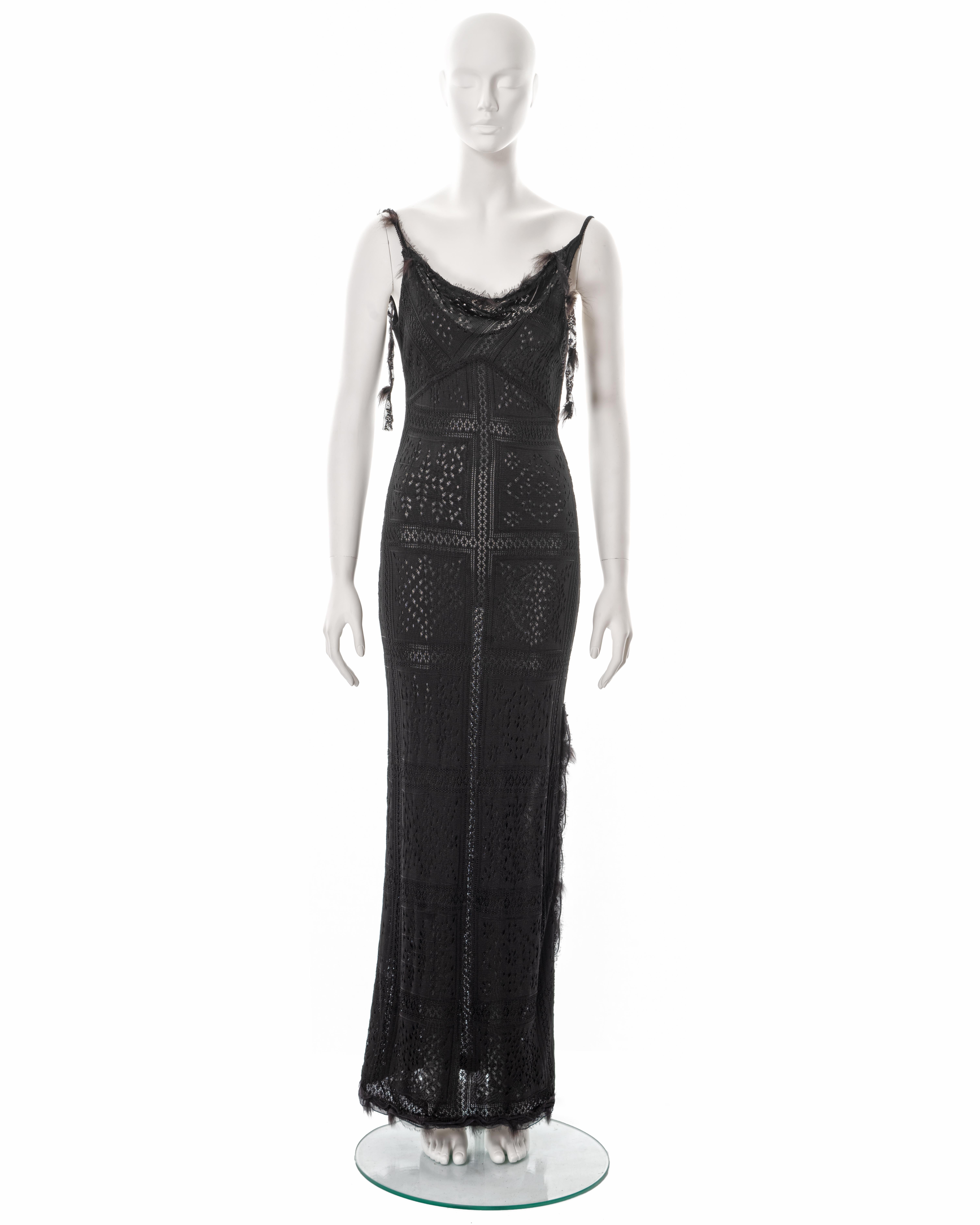 ▪ John Galliano evening maxi dress
▪ Sold by One of a Kind Archive
▪ Fall-Winter 2001
▪ Constructed from lace-knitted viscose 
▪ Cowl neck 
▪ Lace ribbon trimmings with fur 
▪ Floor-length skirt with leg slit
▪ Size Large
▪ Made in Italy

All