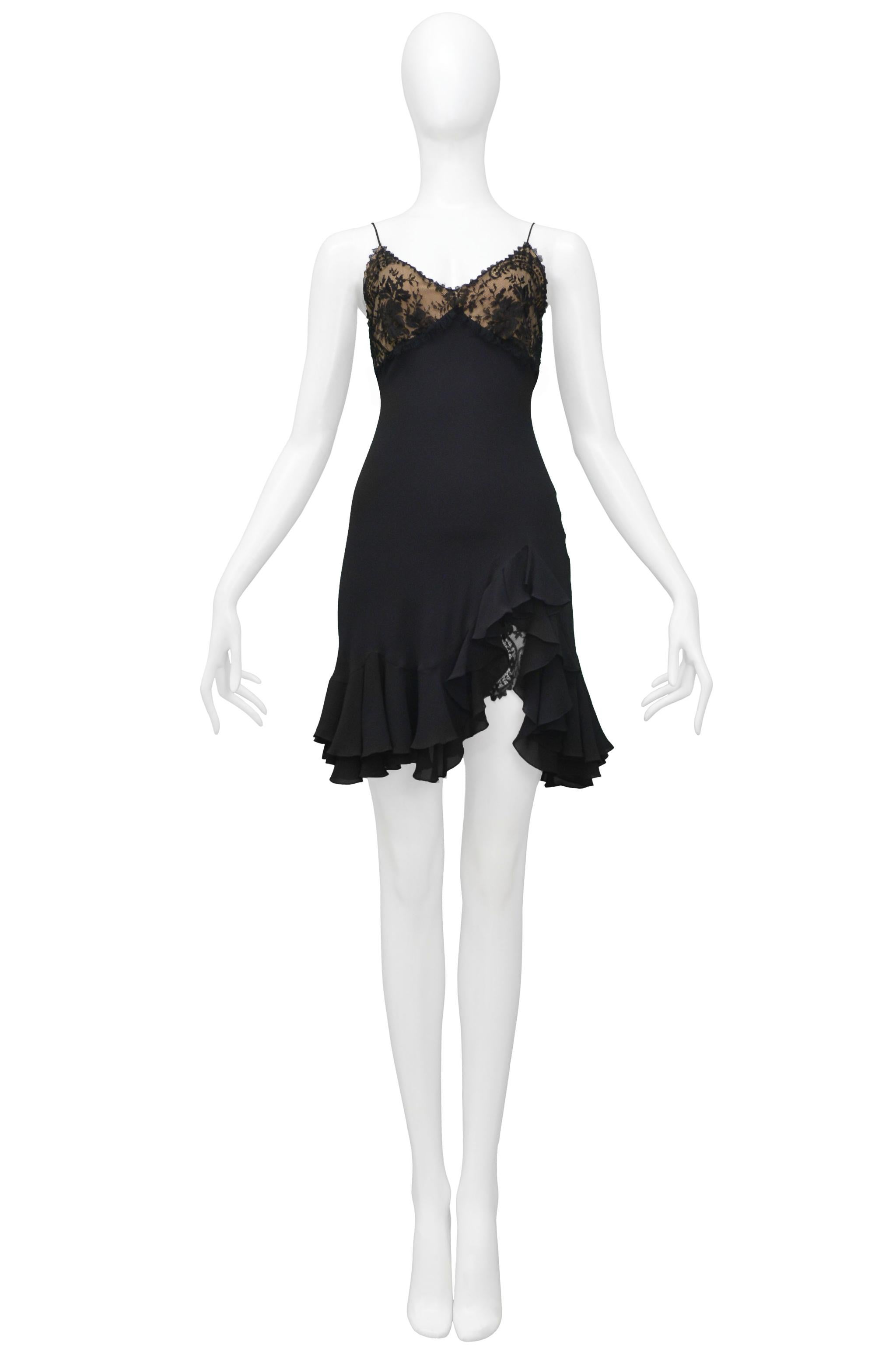 Resurrection is excited to offer a stunning vintage John Galliano black slip dress featuring a black lace bodice with nude lining, side front slip, and ruffles. From the 1997 collection.

John Galliano
Size 40
95% Silk, 5%Viscose
1997 Runway