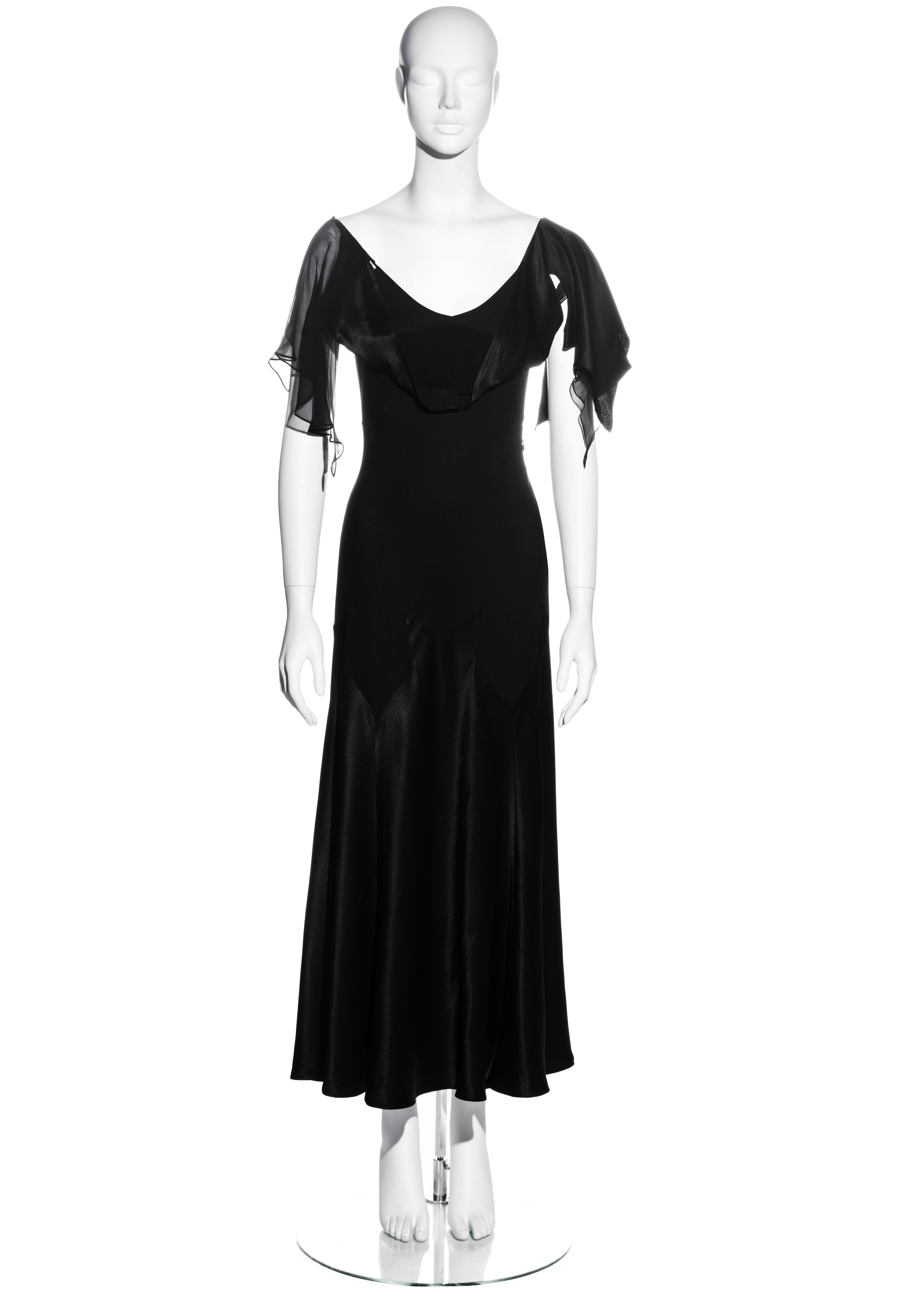 ▪ John Galliano black satin-backed crêpe evening dress
▪ 59% Acetate, 41% Rayon
▪ Swallowtail notched bias-cut inserts to skirt
▪ Draped panels with chiffon underlay to bodice
▪ Invisible zip fastening on side seam 
▪ FR 42 - UK 14 - US 10
▪