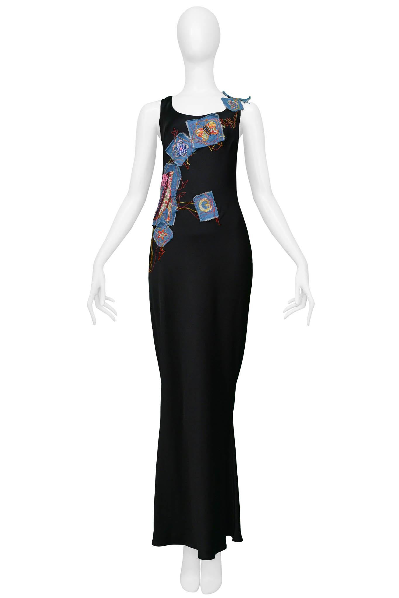 Resurrection is excited to offer a vintage John Galliano black satin gown featuring blue patches with colorful embroidery in the shapes of letters, butterflies, flowers, stars, boots, and a purse.  This dress also features an invisible side seam