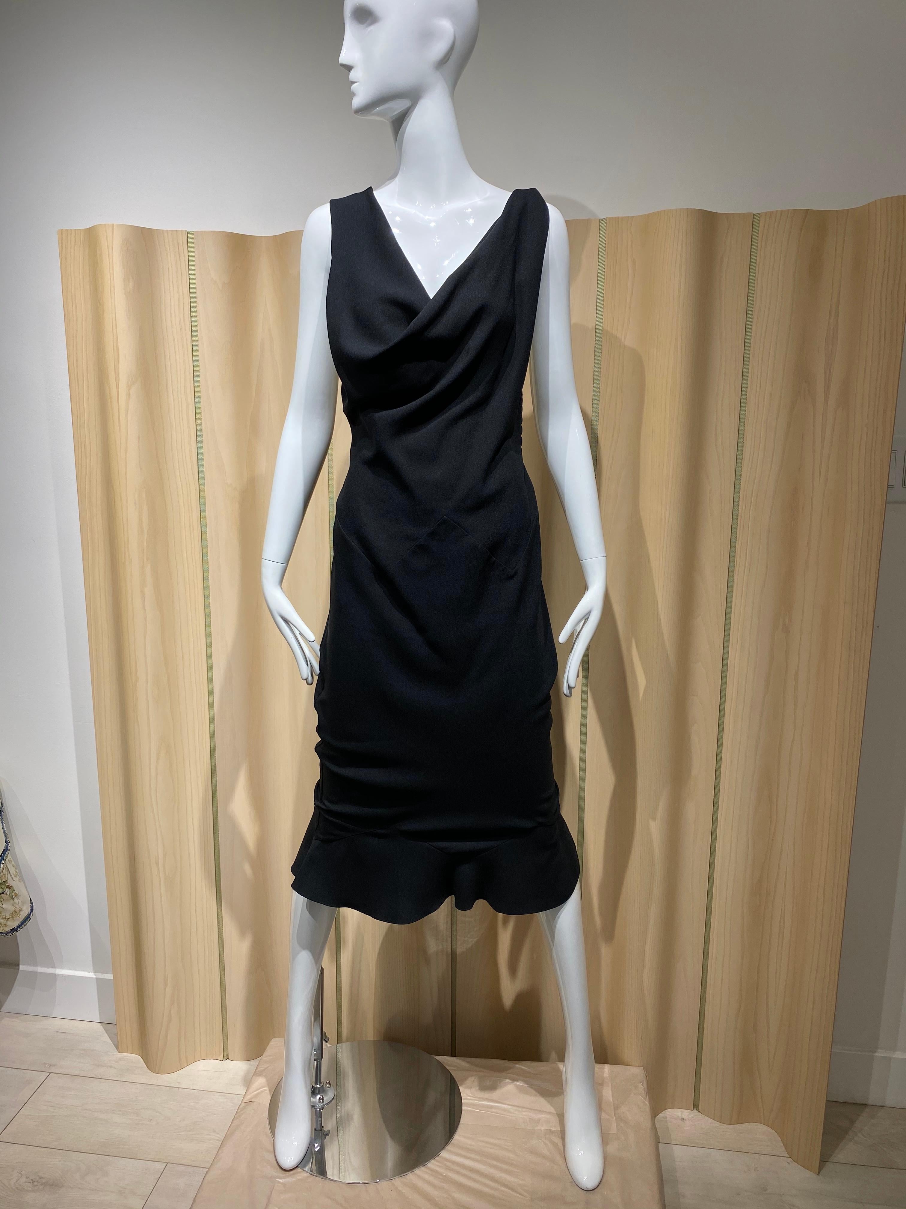 John Galliano Black silk crepe criss cross cocktail dress. 
Fit Size 4/6