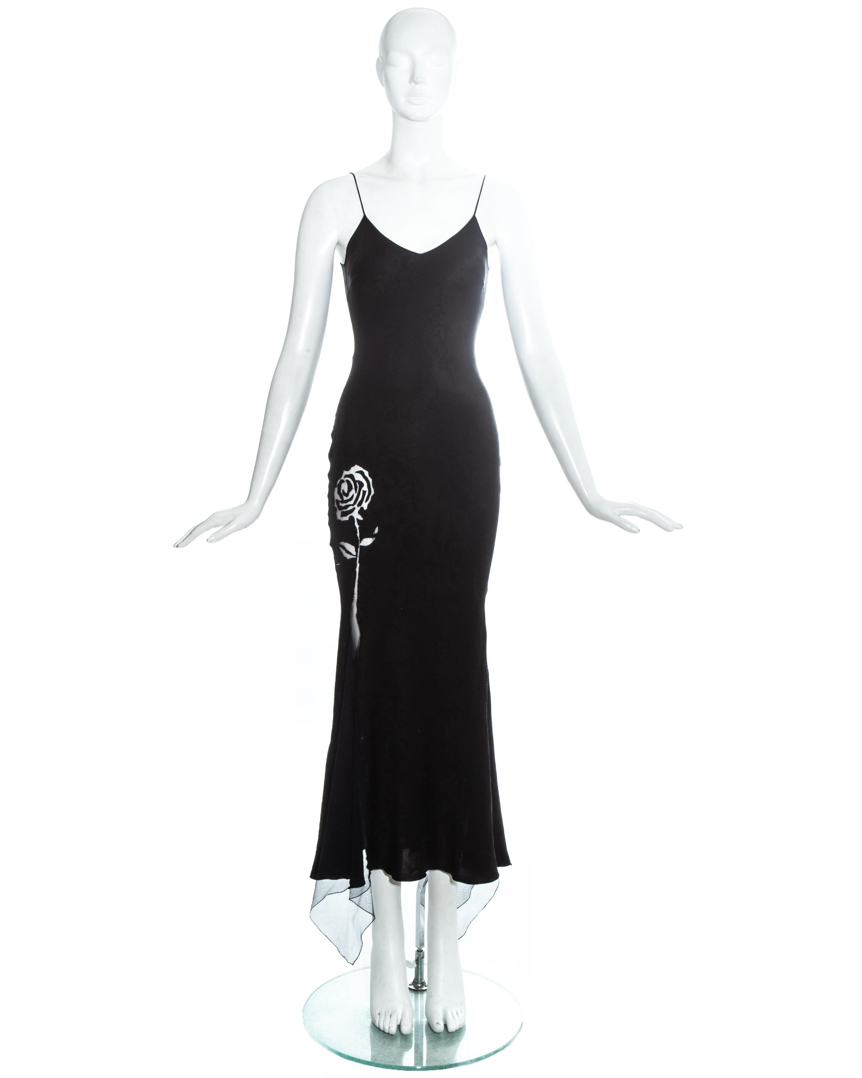 John Galliano black silk jacquard evening dress with floral mesh insets.

Spring-Summer 1998