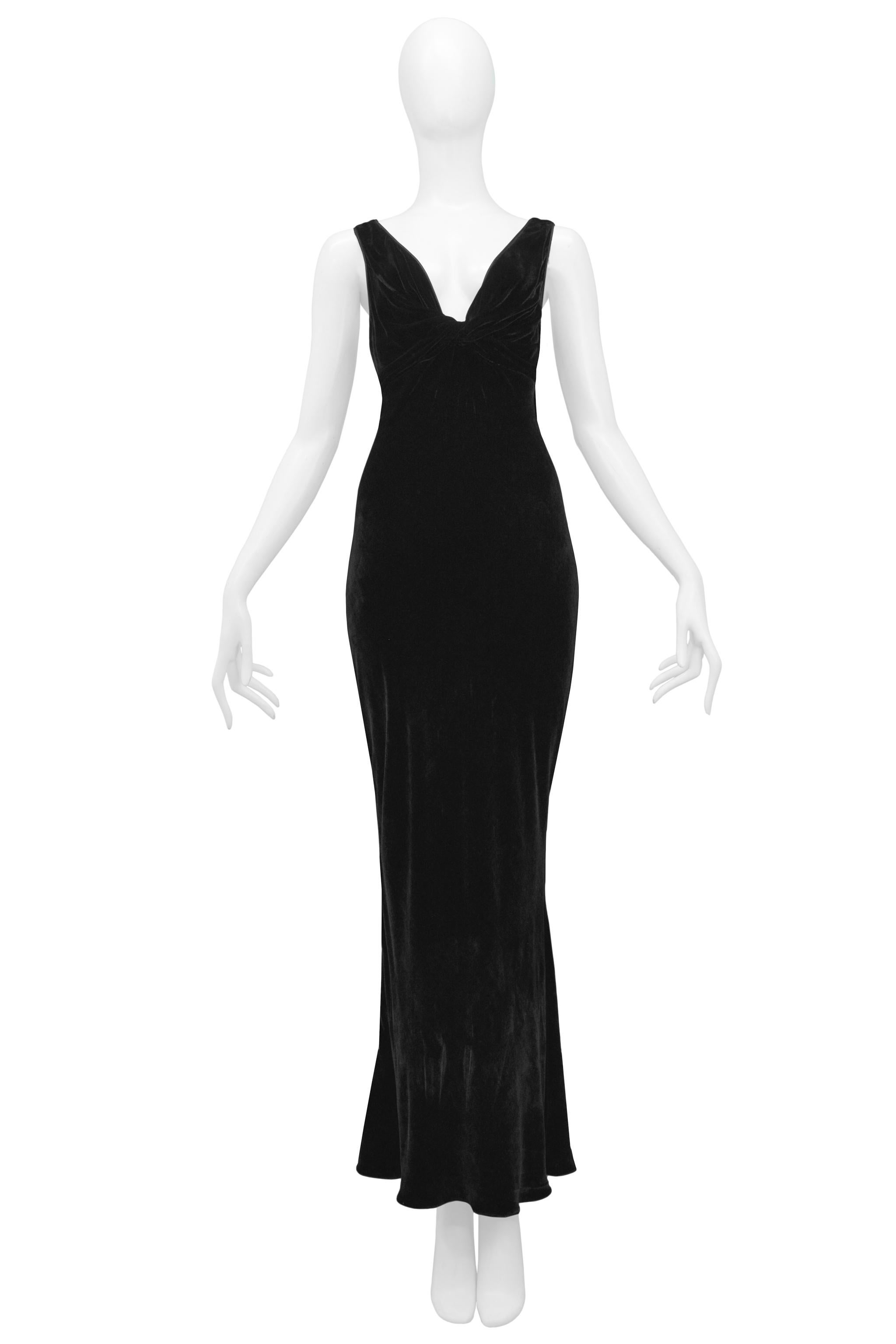 Resurrection is excited to offer a vintage John Galliano black velvet gown featuring a plunging front and back neckline, knot detail at bust, and wide straps. 

John Galliano
Size 6
82% Viscose, 18%Silk
2006 Runway Collection 
Excellent Vintage