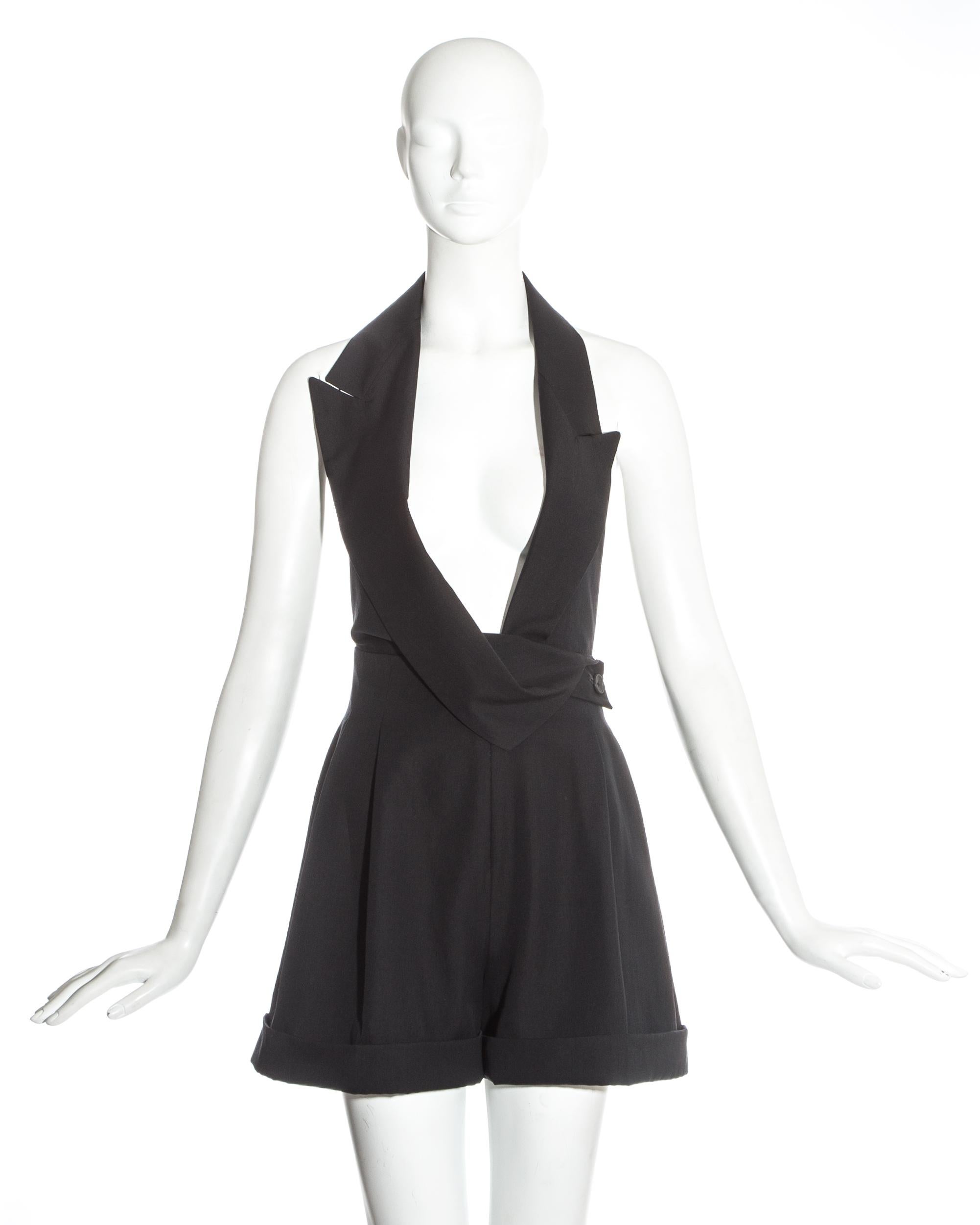 John Galliano black wool halter neck playsuit with open back and asymmetric draped lapel. 

Spring-Summer 1988
