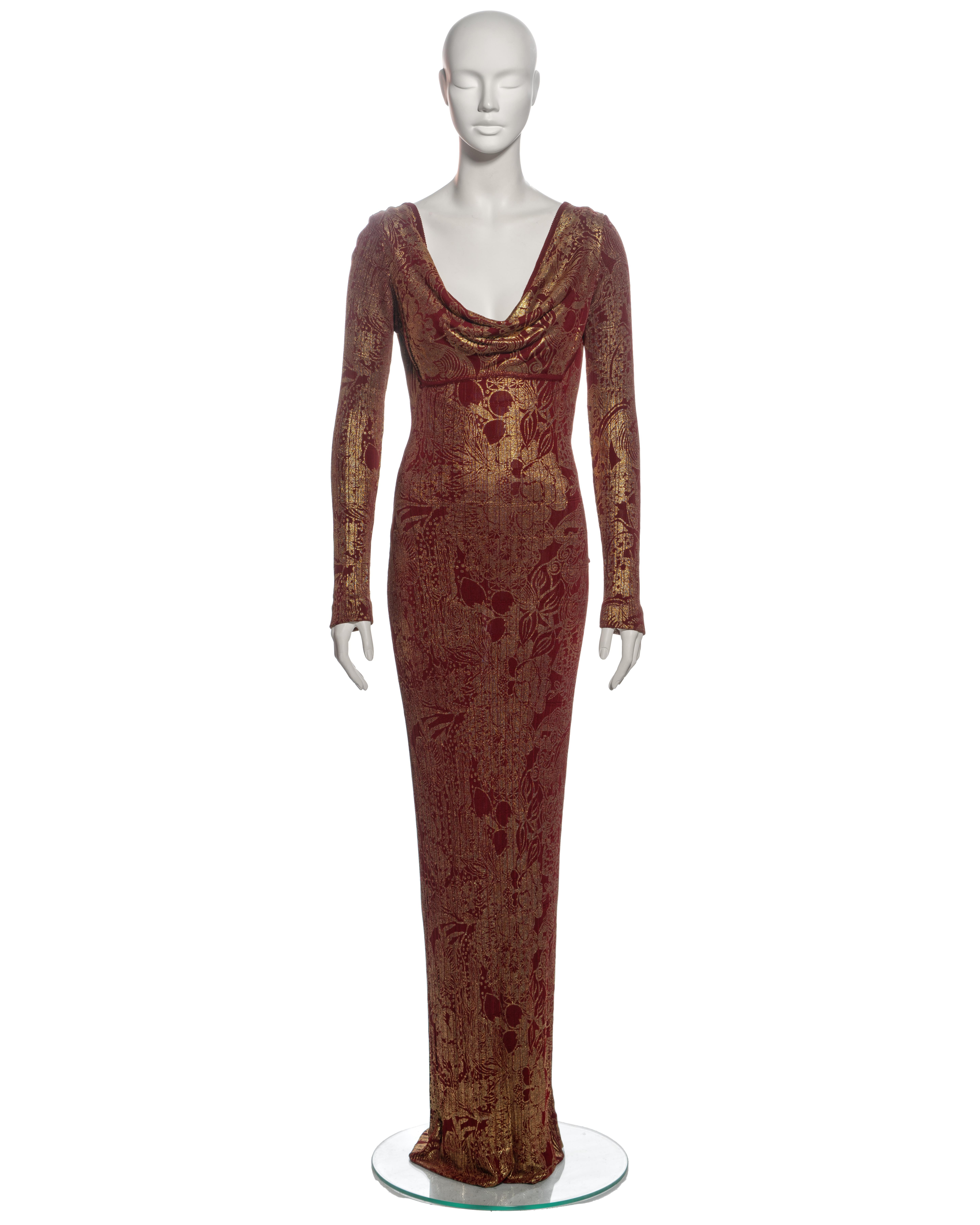 ▪ Archival John Galliano evening dress
▪ Fall-Winter 1998
▪ Sold by One of a Kind Archive
▪ Bordeaux red viscose ribbed knit 
▪ Gold foil floral print 
▪ Draped cowl neckline
▪ Low back accentuated with draped cowls
▪ Long fitted sleeves
▪ Floor