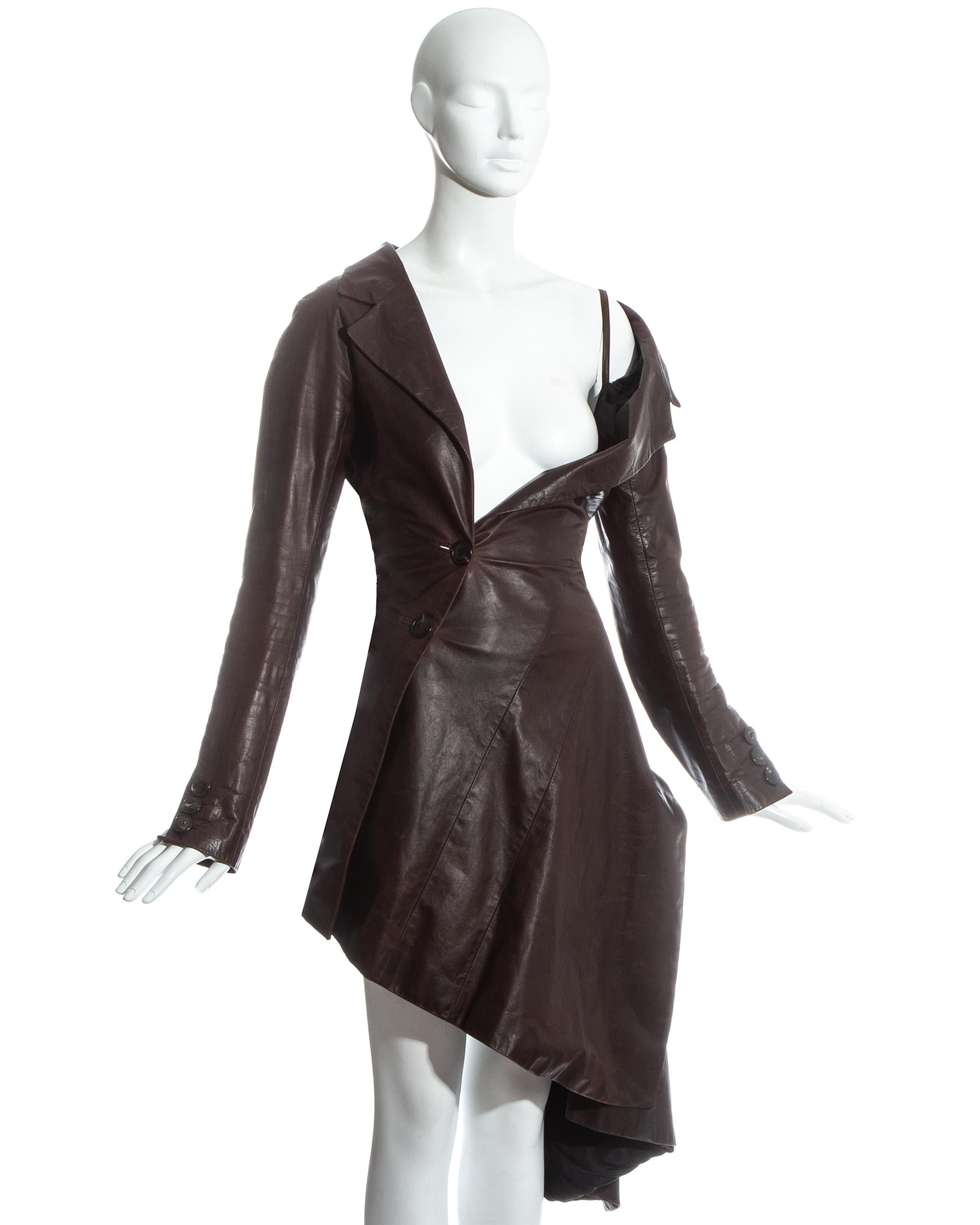 John Galliano; Brown distressed leather twisted coat dress. Bias cut panels, two button fastenings and one exposed shoulder with built in shoulder strap.

Fall-Winter 2000