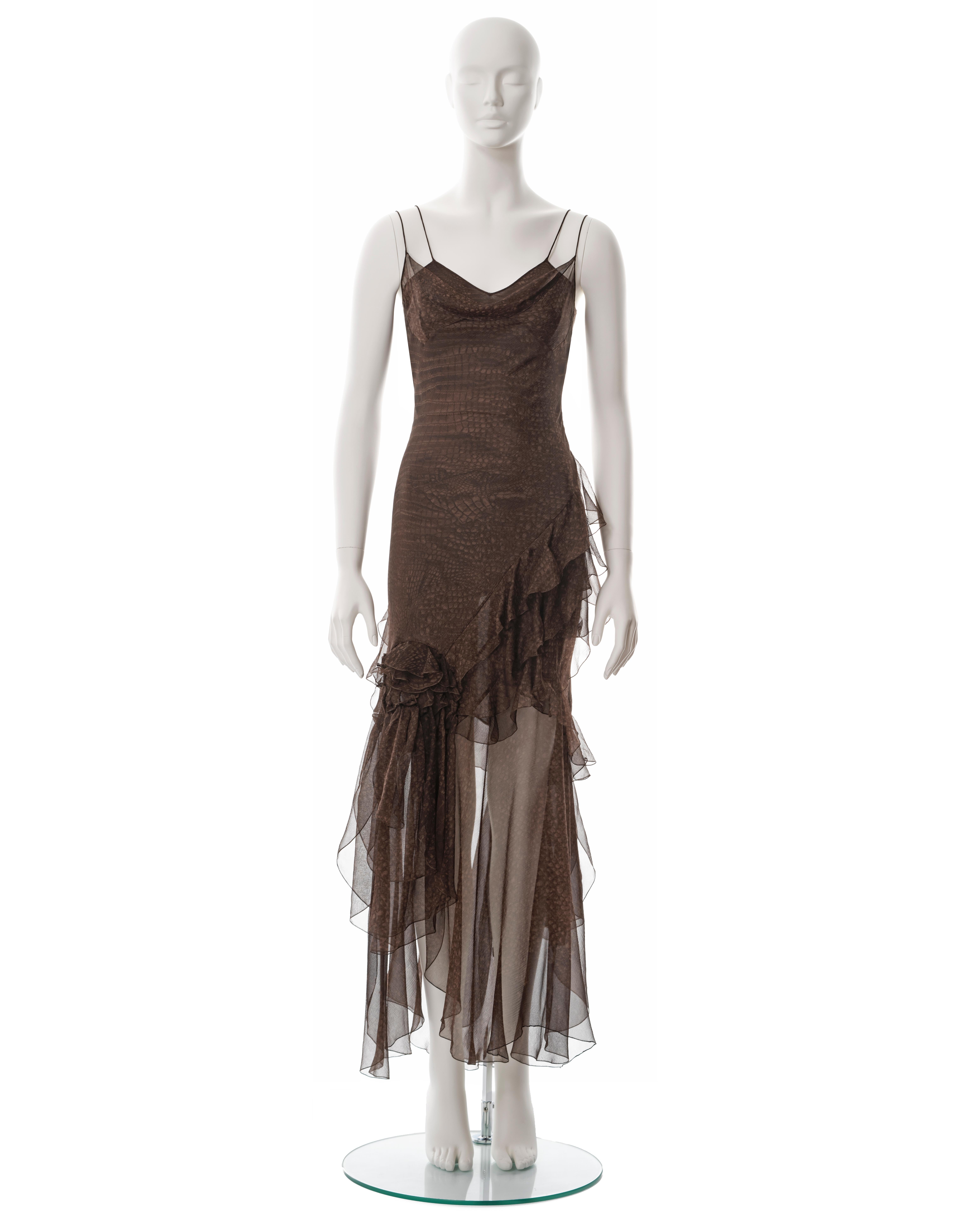 ▪ John Galliano brown bias-cut silk chiffon evening dress
▪ Fall-Winter 2000
▪ Reptile-skin print 
▪ Cowl neckline
▪ Double layered
▪ Asymmetric skirt 
▪ Chiffon frill trim 
▪ 2 rose corsages 
▪ FR 36 - UK 8 - IT 40
▪ Made in France

All photographs