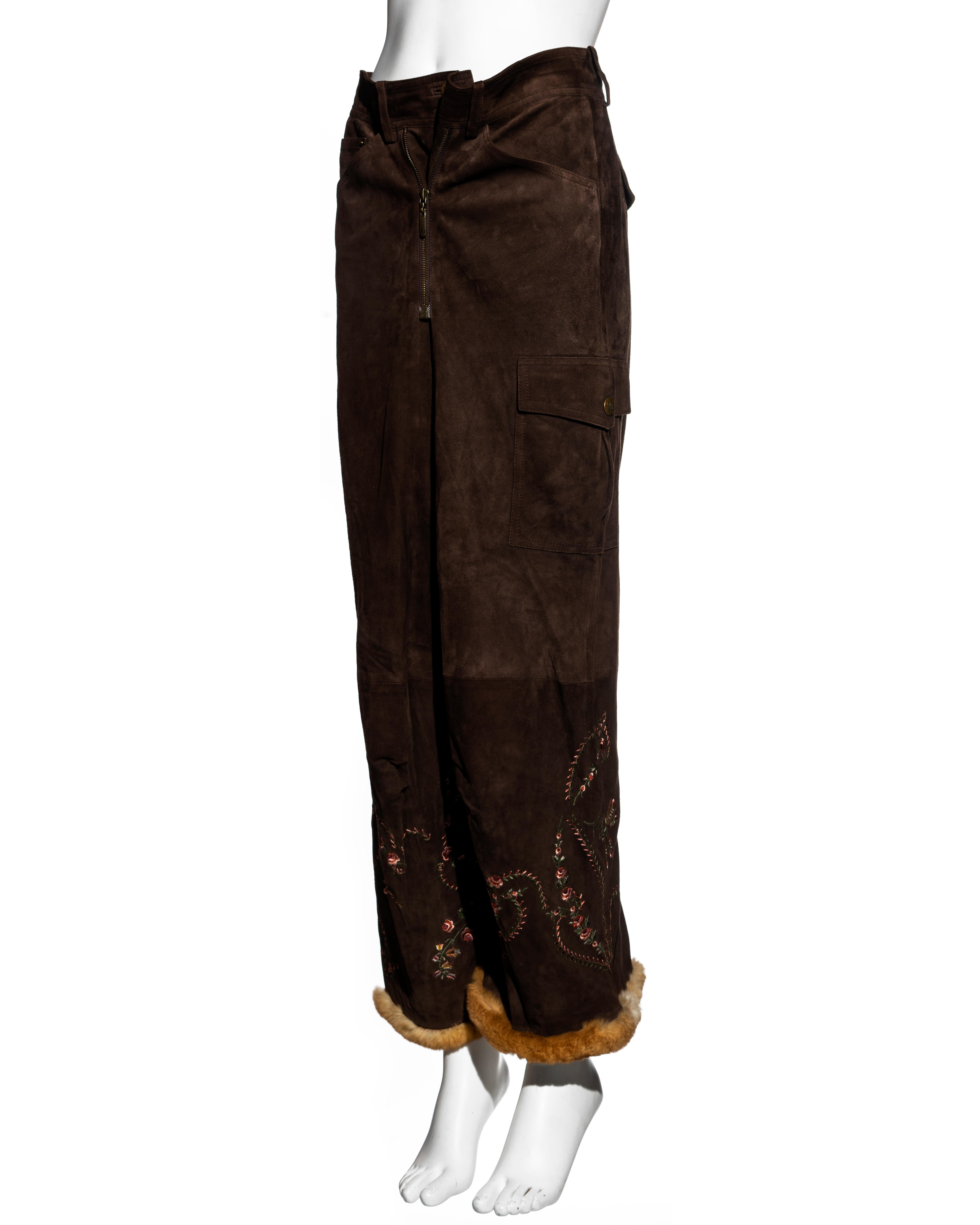 ▪ John Galliano brown suede cargo pants 
▪ Curved-leg
▪ Pink floral embroidery 
▪ Orliag fur trim at the hem 
▪ Double zip fastening with the option to style as low or high waisted
▪ Cargo pockets 
▪ Buckle fastening at the center-back
▪ Silk lining