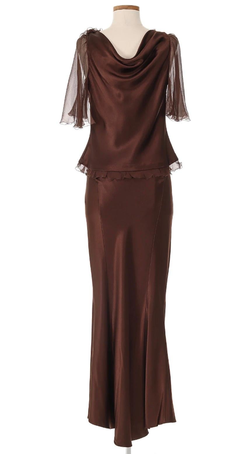 John Galliano Skirt Set in a rich brown silk. This is a luxurius & feminine ensemble that drapes beautifully onto the body. This piece is understated yet glamorous with a timeless appeal.

Top

Shoulders 18 in
Bust 36 in
Waist 31 in
Sleeve 13