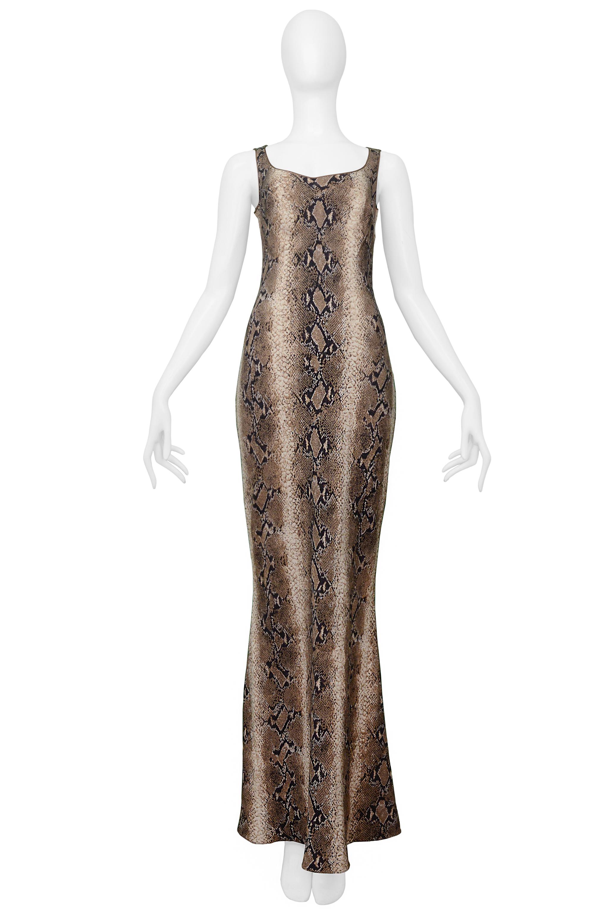 Resurrection Vintage is pleased to offer a vintage John Galliano brown tone maxi dress featuring a snakeskin print, taupe trim, side zipper, and maxi length.

John Galliano 
Size 40
Knit
Excellent Vintage Condition 
Authenticity Guaranteed 