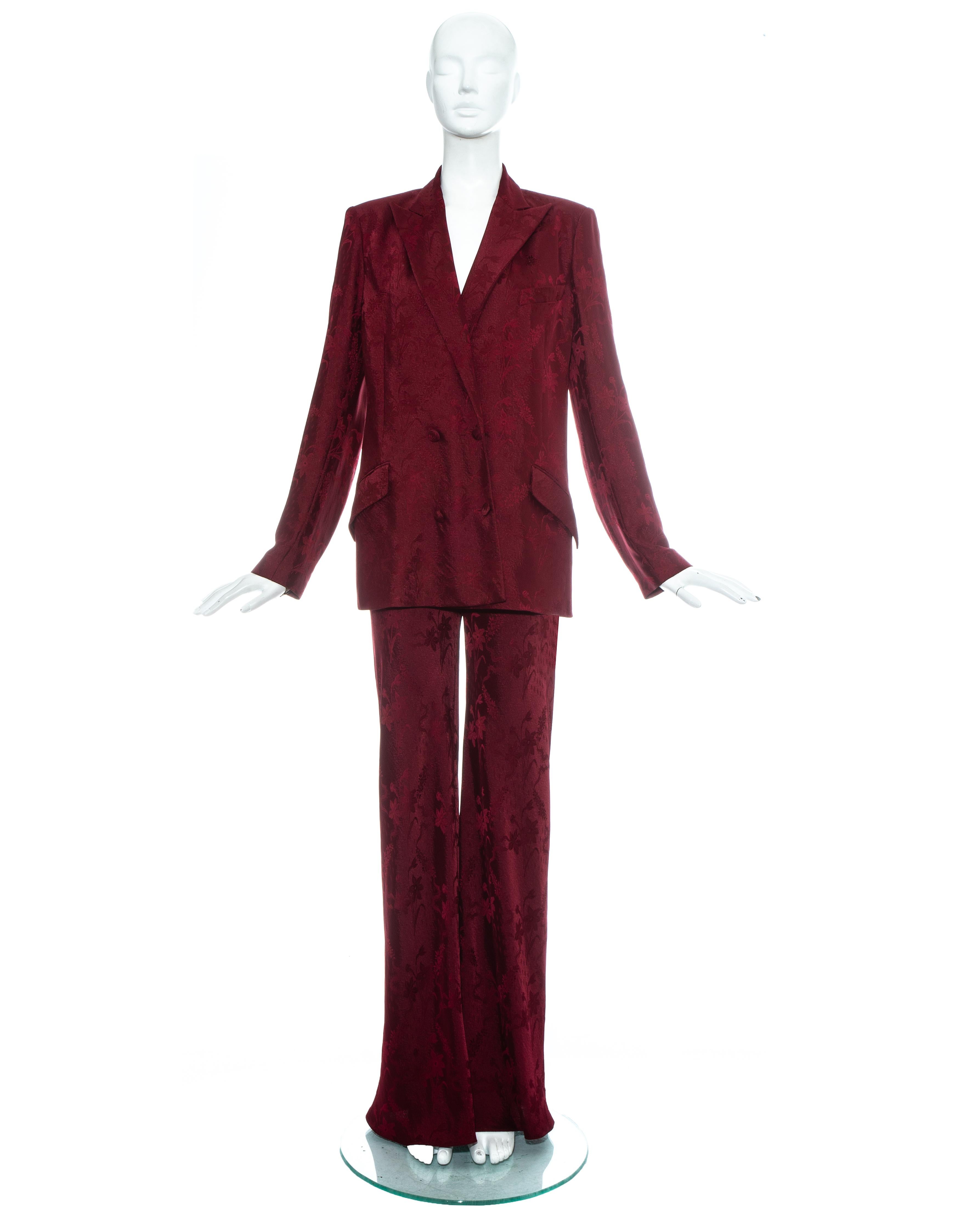 John Galliano; Burgundy floral brocade pant suit. Loose cut double breasted blazer jacket and high waisted flared pants.

Spring-Summer 1998