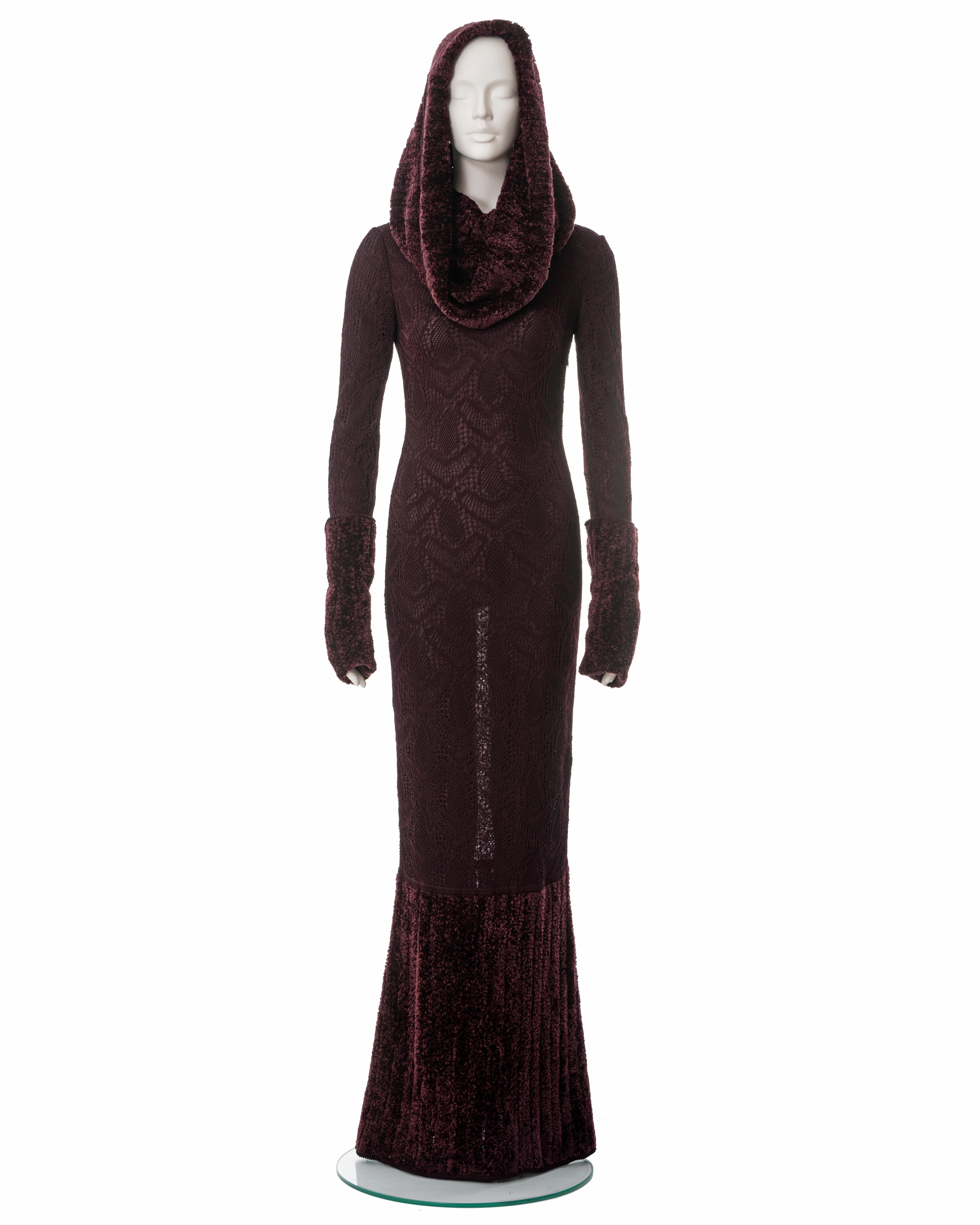 ▪ John Galliano burgundy knitted lace evening dress
▪ Sold by One of a Kind Archive
▪ Fall-Winter 1999
▪ Chenille skirt, turn-over cuffs and large off-shoulder collar which can double as a hood 
▪ Double-layered 
▪ Concealed side seam zipper 
▪ Size