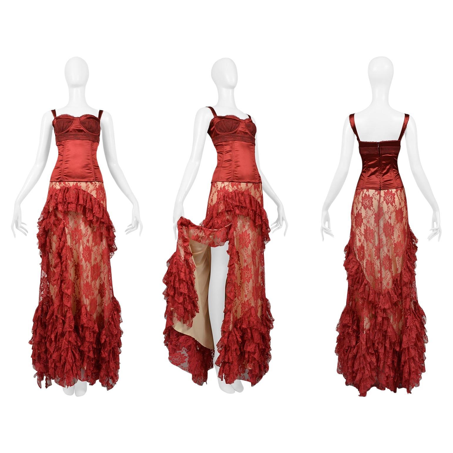 Resurrection Vintage is delighted to offer a romantic vintage John Galliano red evening ensemble featuring a dramatic ballgown length skirt with a high slit, lace ruffle layers, solid off-white lining, an invisible zipper at the back, and metal