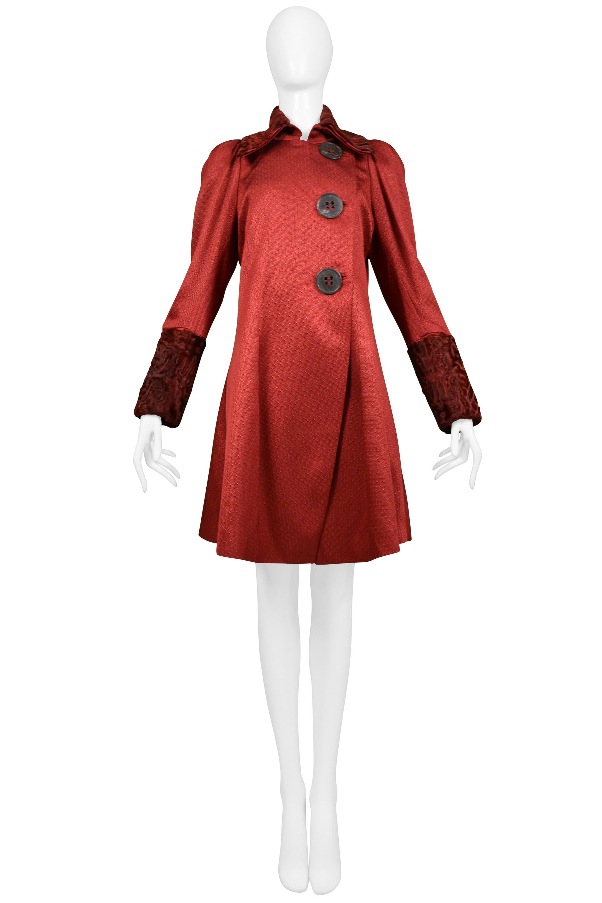 Resurrection Vintage is excited to offer a stunning vintage John Galliano burgundy red fancy coat featuring curly lamb fur collar and cuffs, leg-of-mutton-sleeves, extra large buttons stamped 