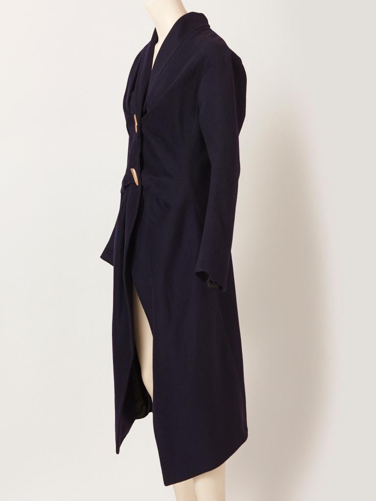 John Galliano, navy blue, cashmere coat, having a small shawl collar, fitted bodice that is slightly ruched, and a 