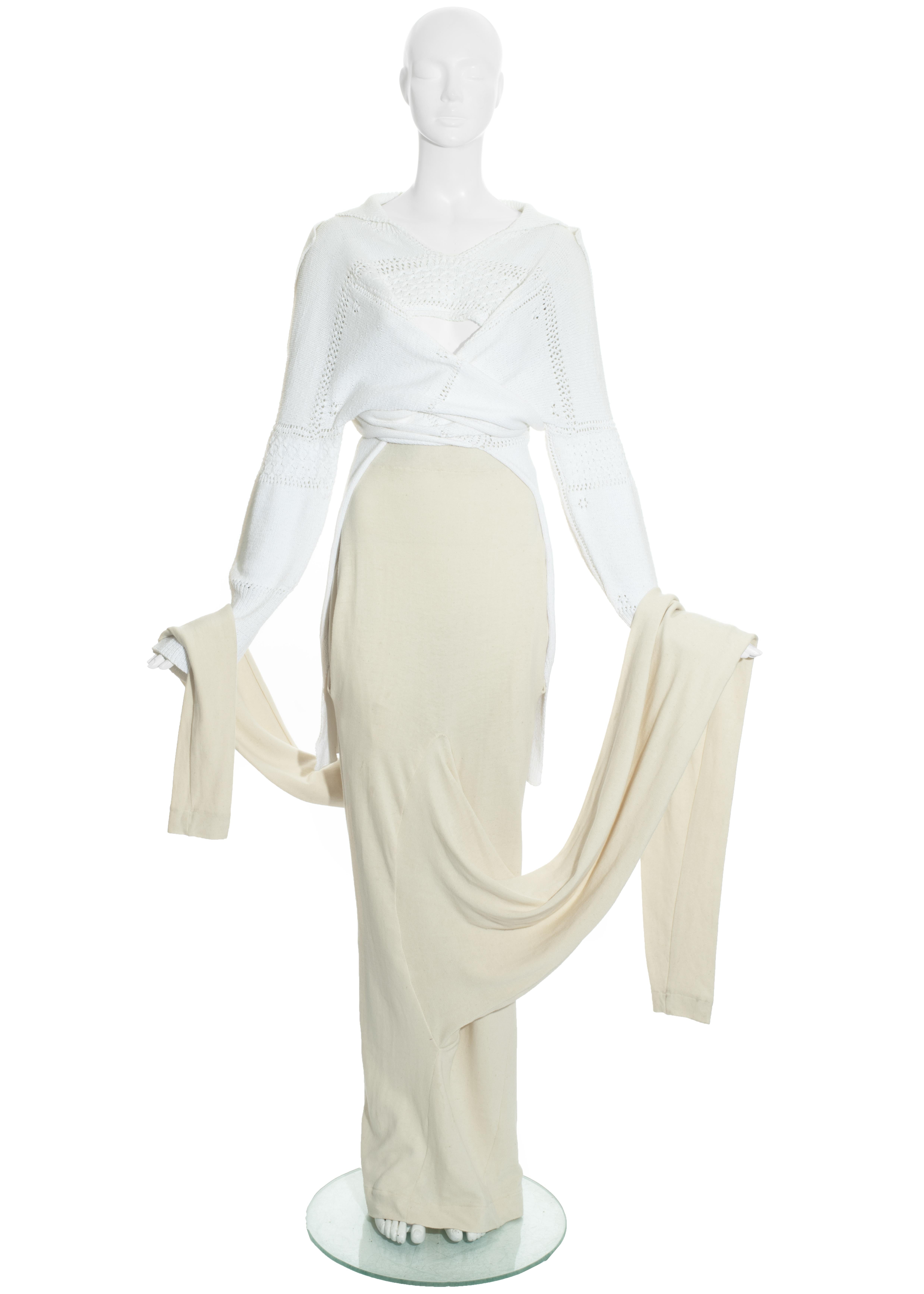 John Galliano skirt suit comprising: white knitted cotton sweater with two sleeves used as button-up fastenings, cream ribbed cotton maxi skirt with two extra long sleeves. 

'The Ludic Game' Autumn-Winter 1985