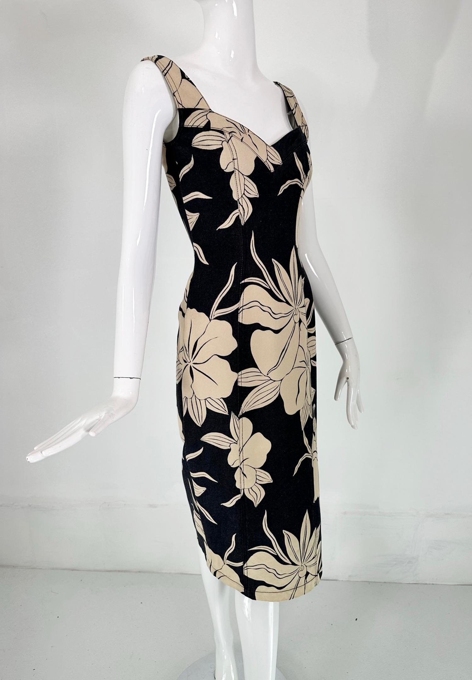 John Galliano dark denim body con dress with tan tropical flowers. This 100% cotton dress is prefect for hot weather, with it's low cut neckline & high cut side hem vent it will take you from a casual afternoon to an evening cocktail hour. Fitted