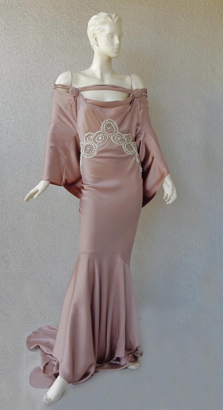 Circa f/w 2008 John Galliano mauve silk charmeuse dress adorned with deco inspired faux pearl and crystal beadwork.  Features kimono sleeves.  Draped neckline held securely with singular horizontal silk narrow strap.  Neckline additionally adorned