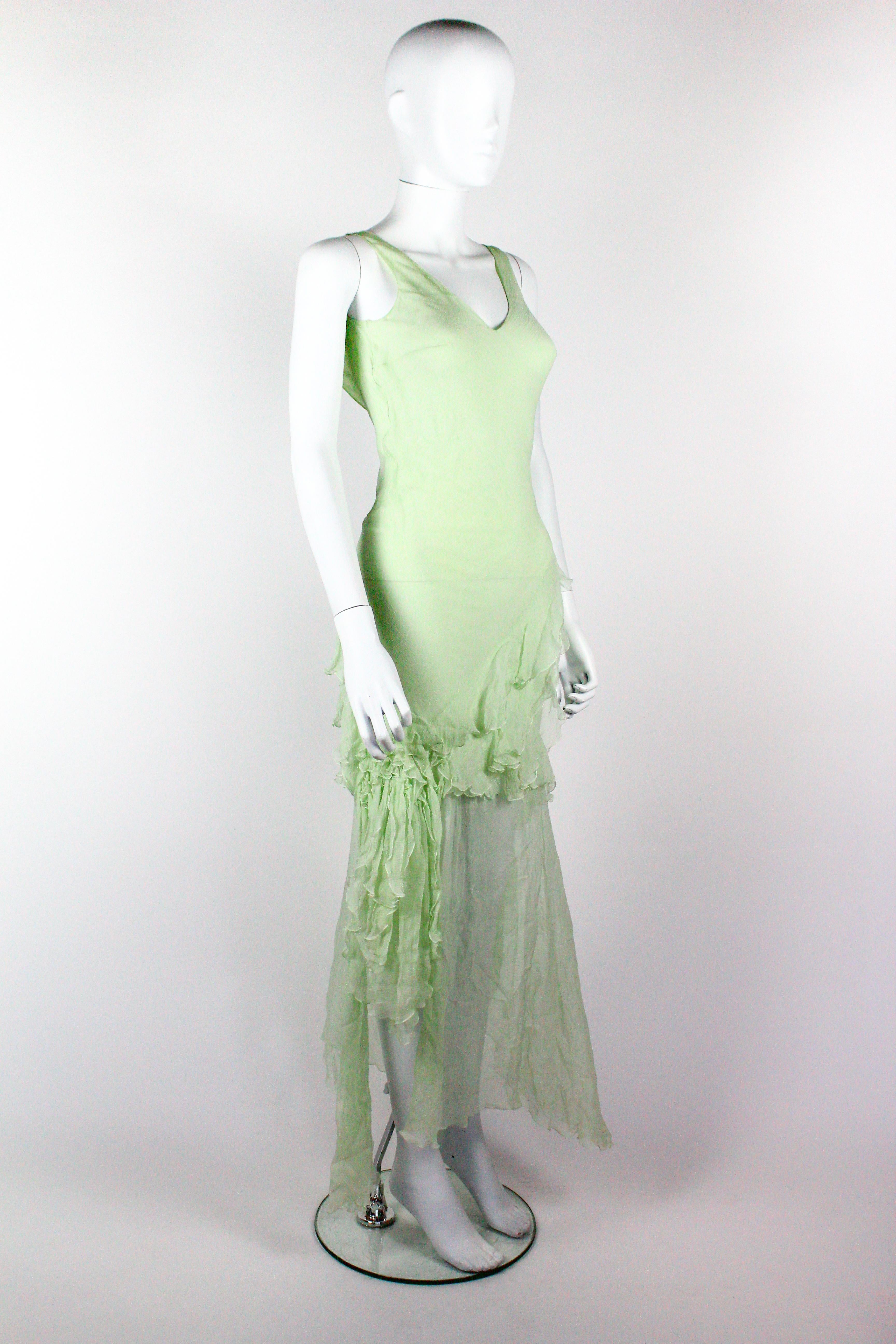 John Galliano silk dress in mint green, from the Fall/Winter 1995 'Delores' collection, a tribute to the Mexican actress Dolores del Rio. As seen on the runway. The dress features beautifully constructed ruffles of silk chiffon and a draped chain on